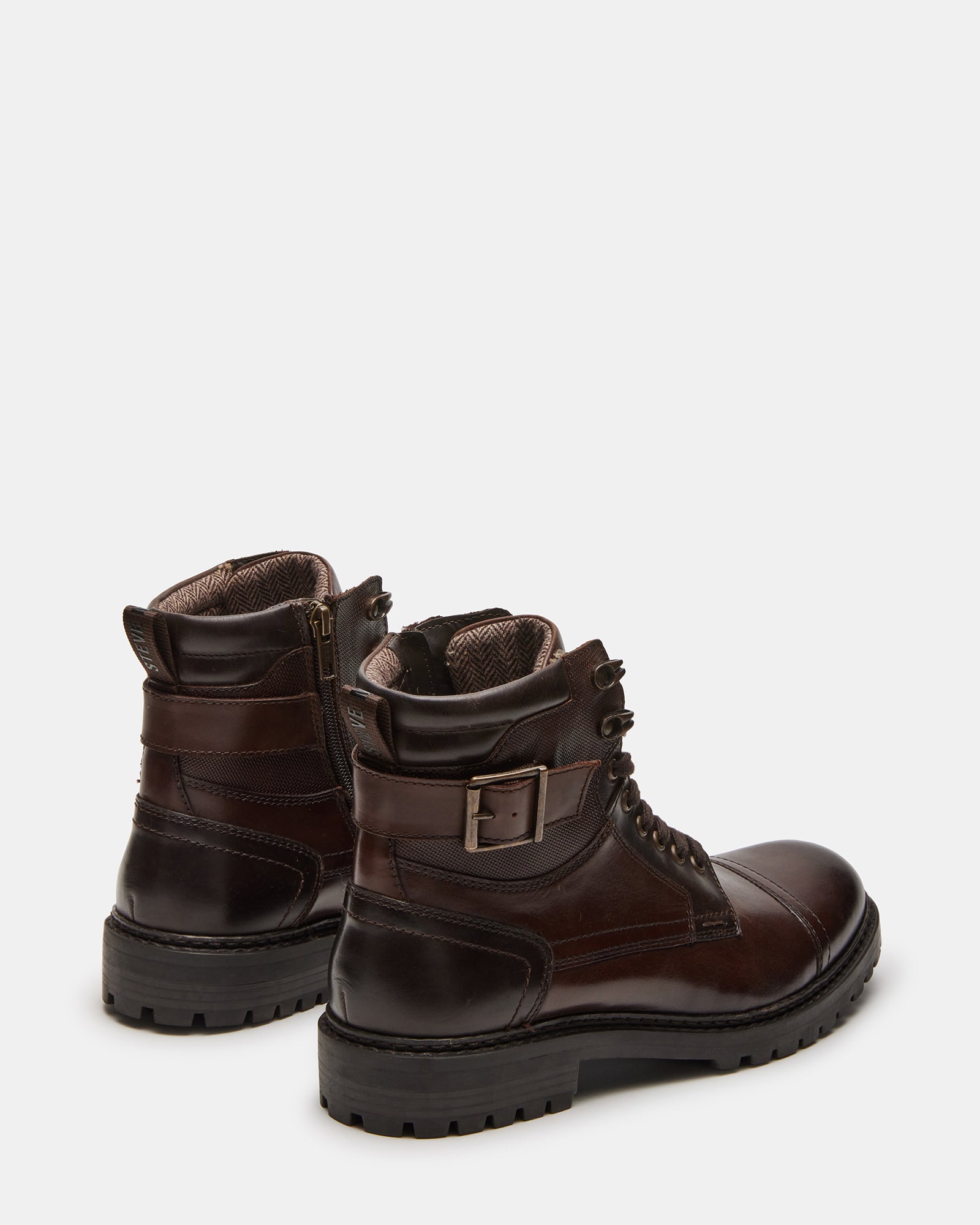 Back heel angle of fashion boots showing heel tab and zip closure