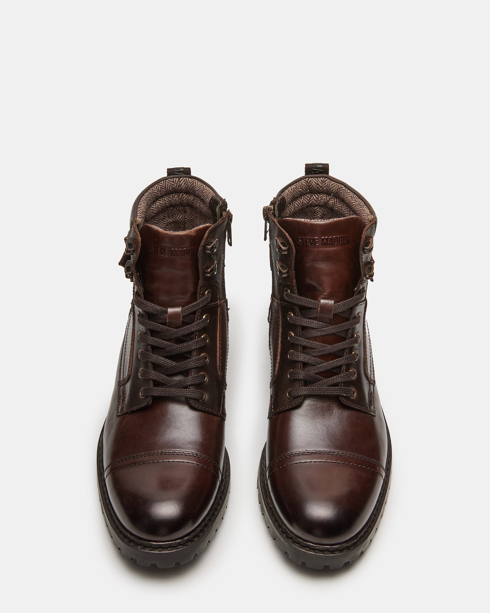 Side view of dark brown leather ankle boots on wooden floor