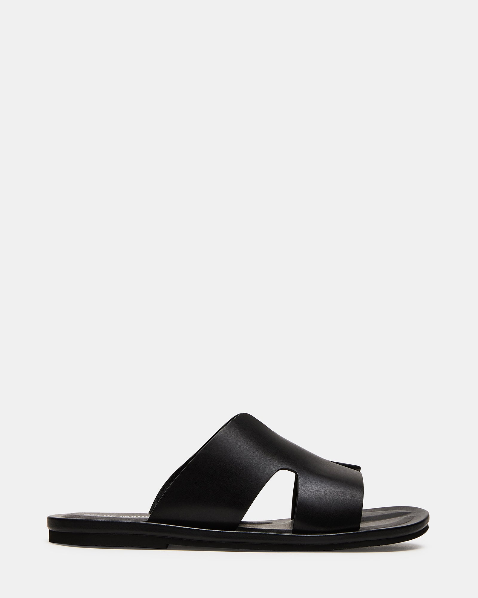 Side view of black leather sandals highlighting the slip-on design.