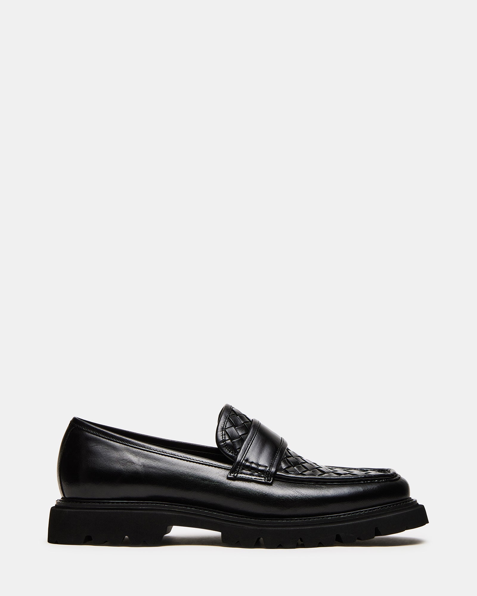 Side view of Strand black leather loafers on a neutral background