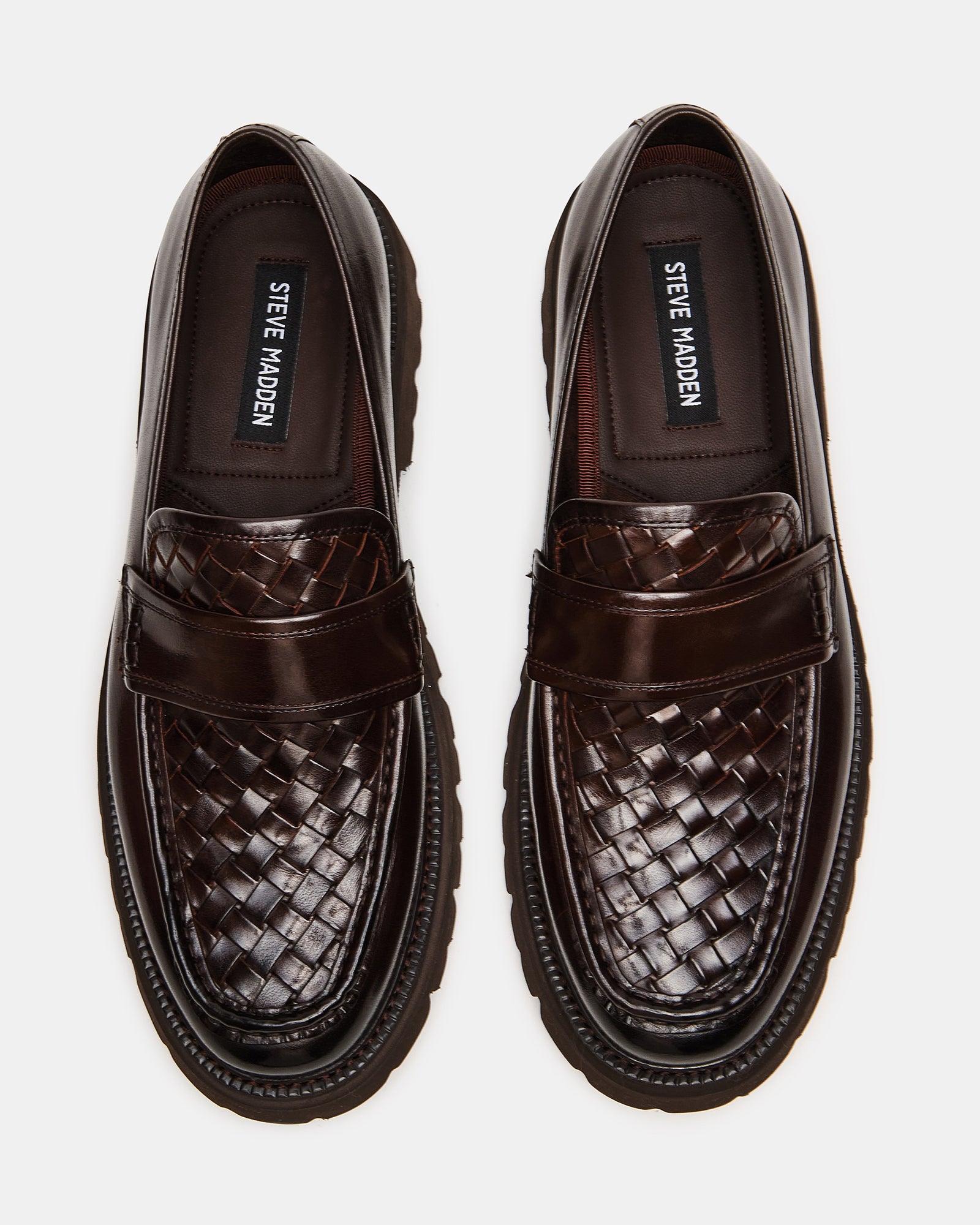 Side view of Strand brown leather loafers for women with woven design.