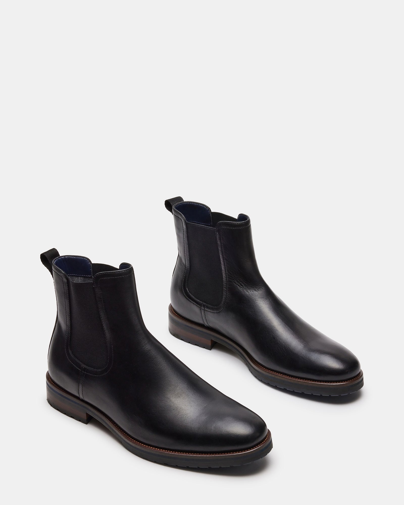 Top-down perspective of SYRE brown leather boots option with pull-on design
