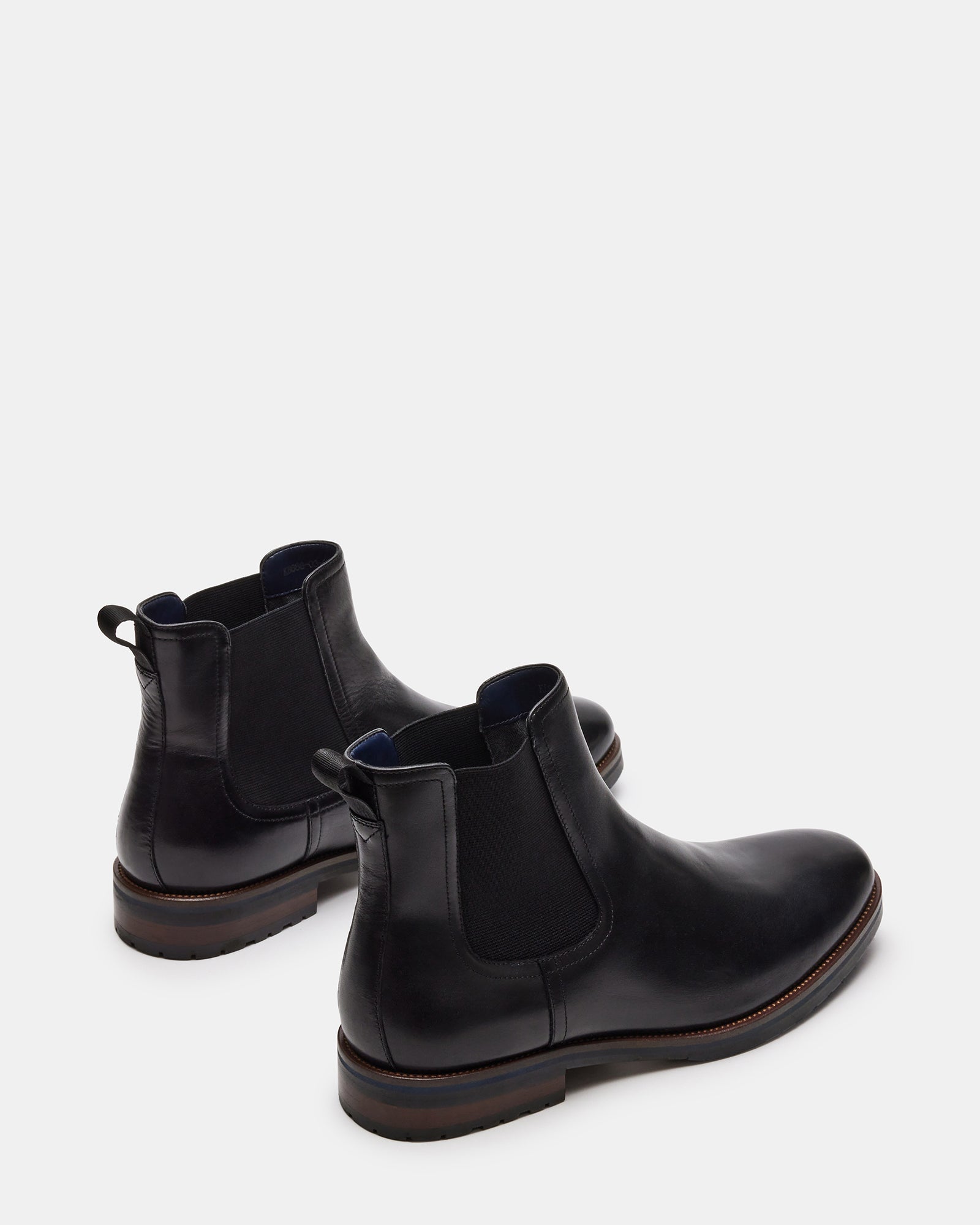 Top-down perspective of SYRE brown leather boots option with pull-on design