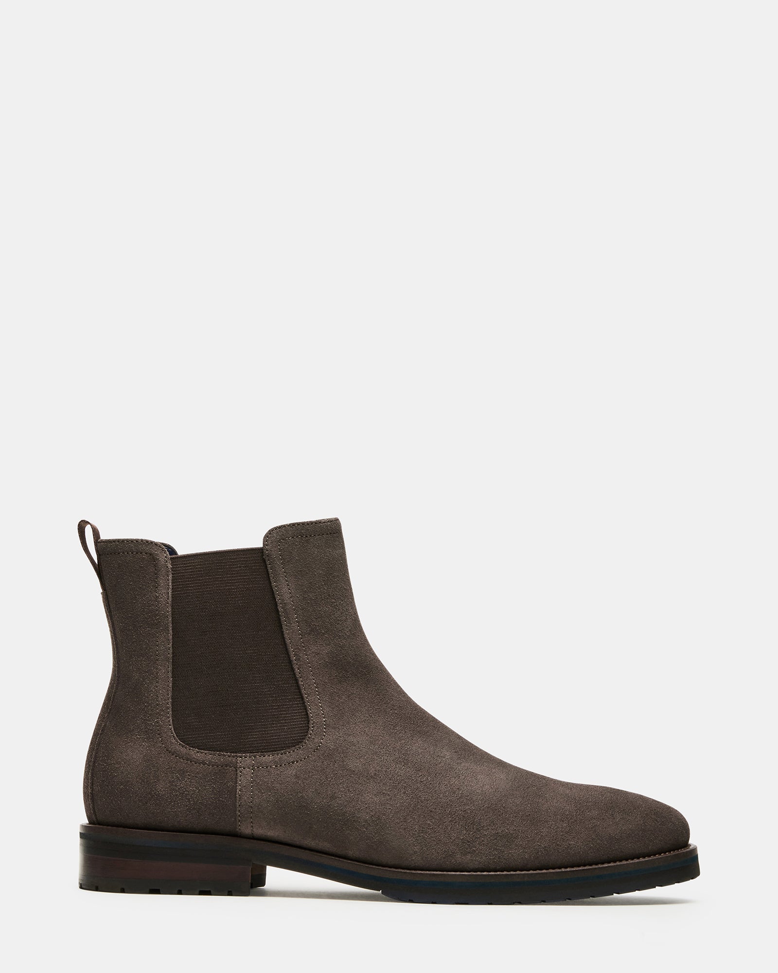 Side angle of brown suede ankle boots showing stretch inset and heel tab