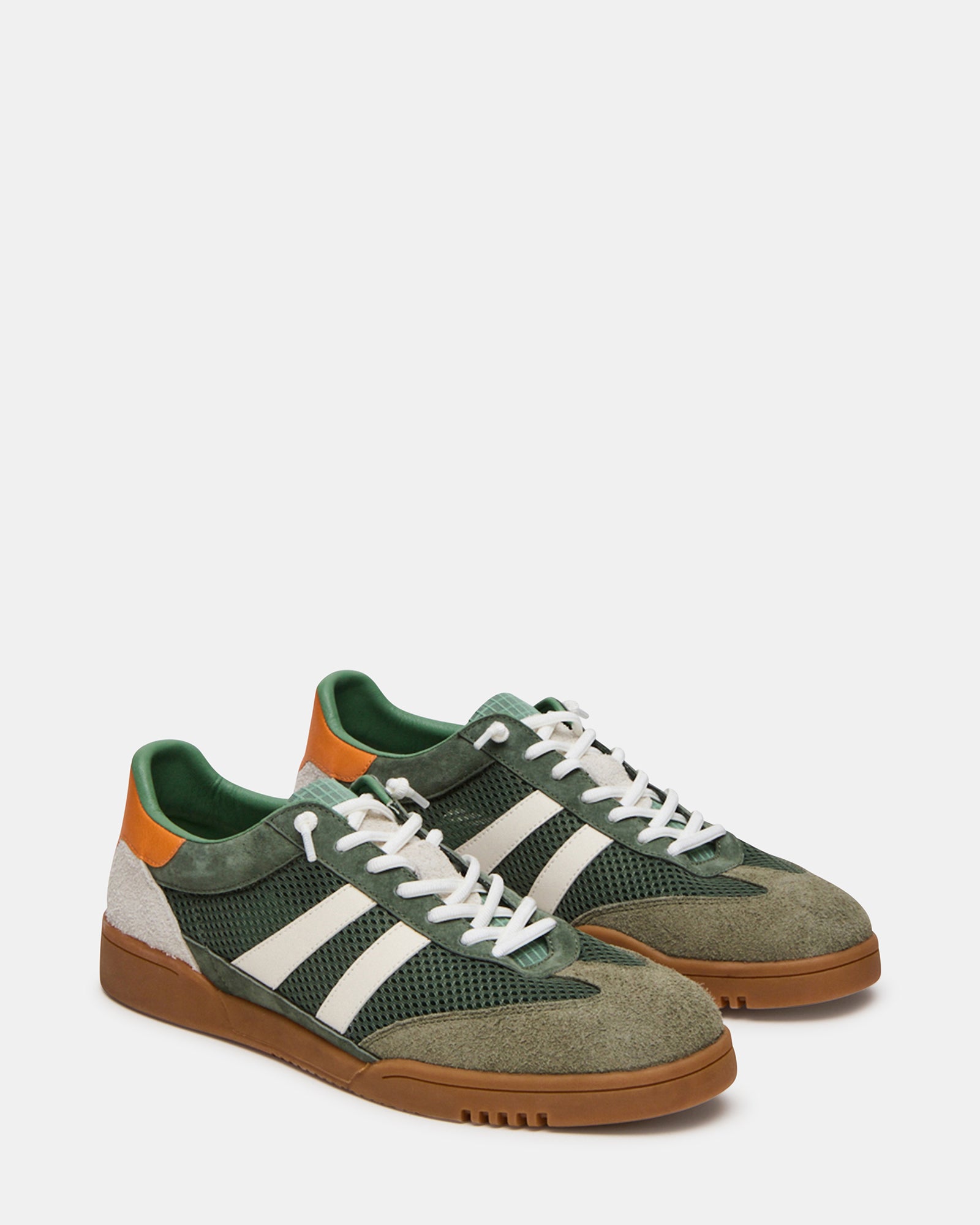 Model wearing VIENTO Green Multi sneakers in a casual outdoor setting.