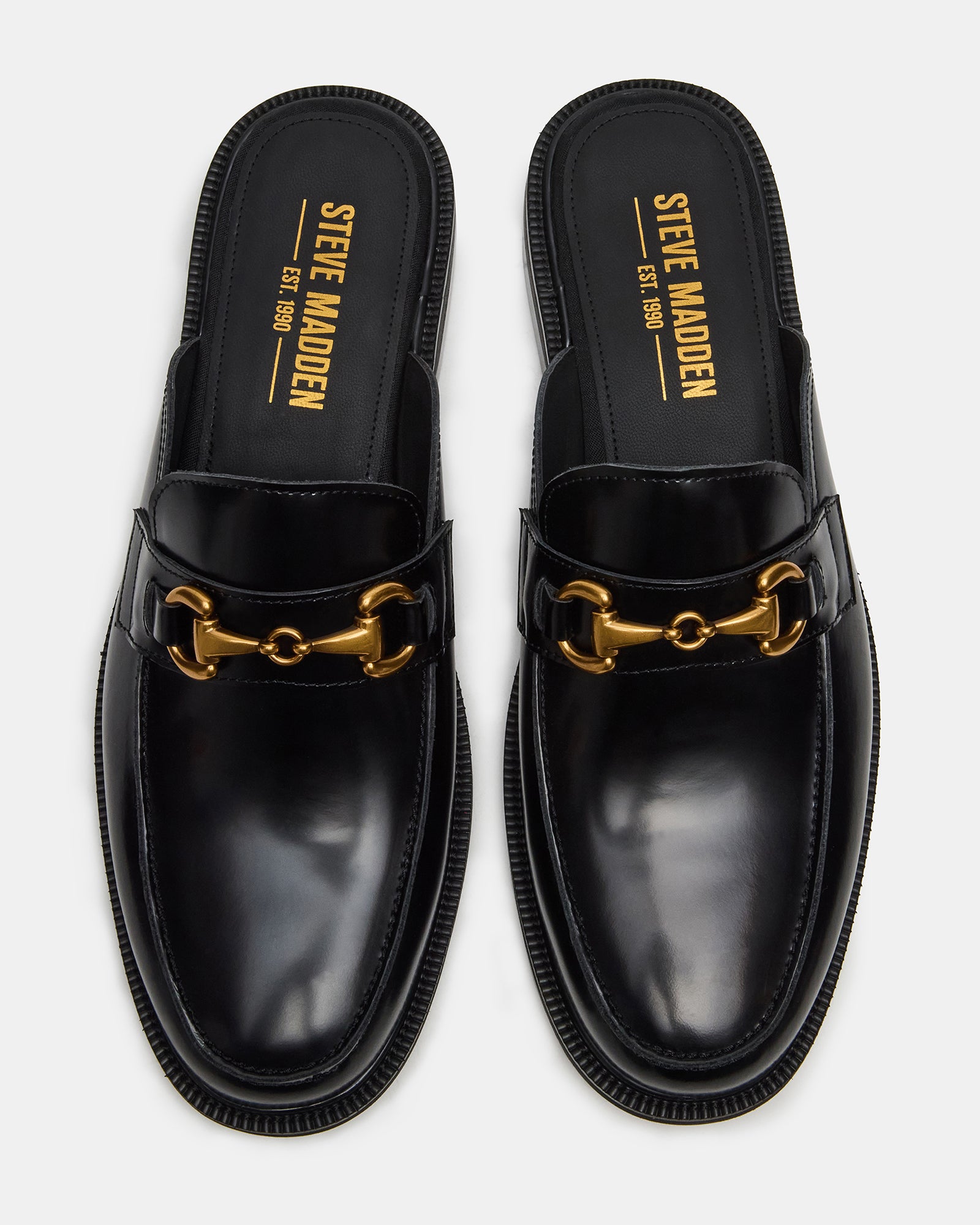 Mens black leather loafers showcasing slip-on design and sleek finish.