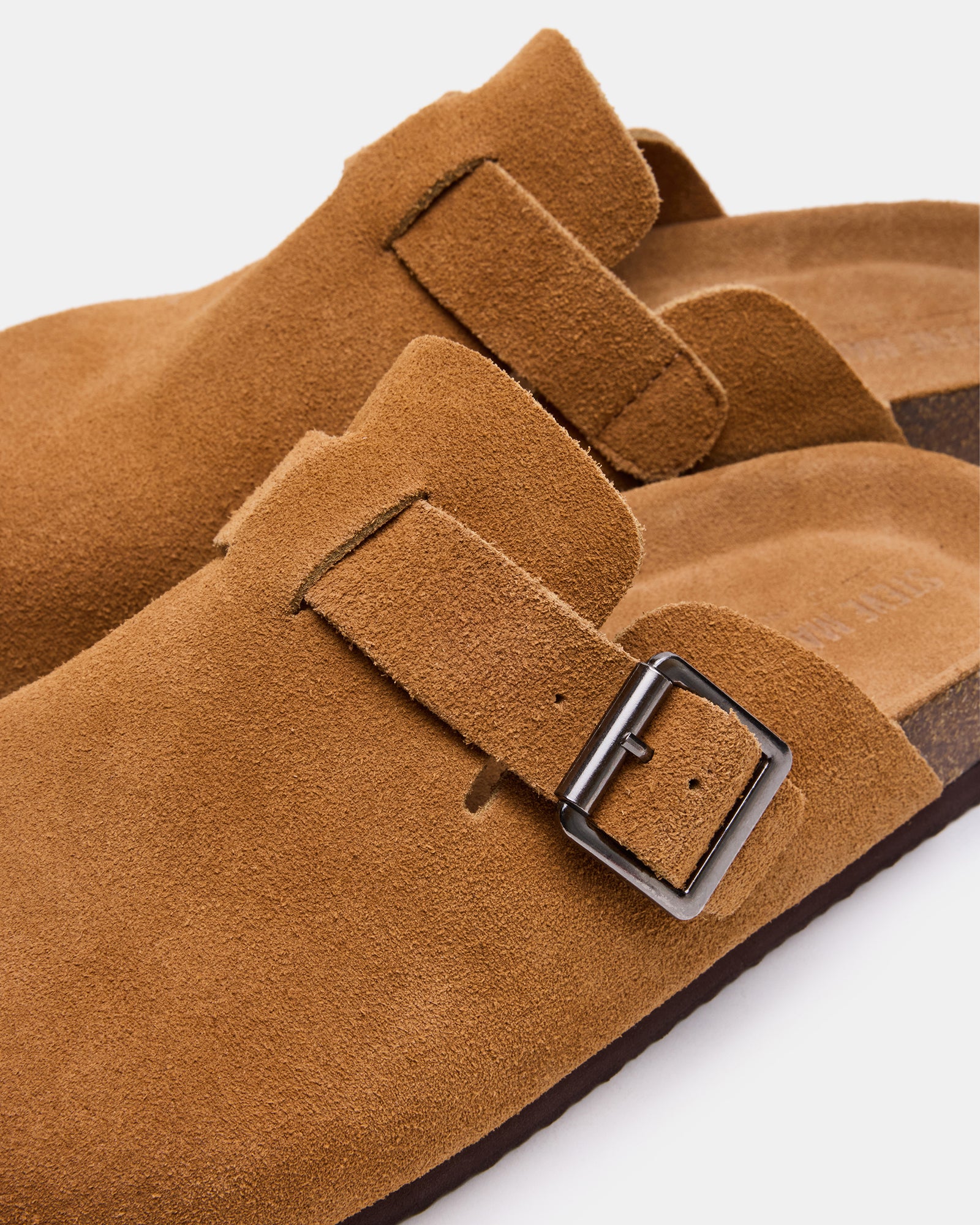 Mens casual suede shoes displayed in a relaxed setting, highlighting their versatility.