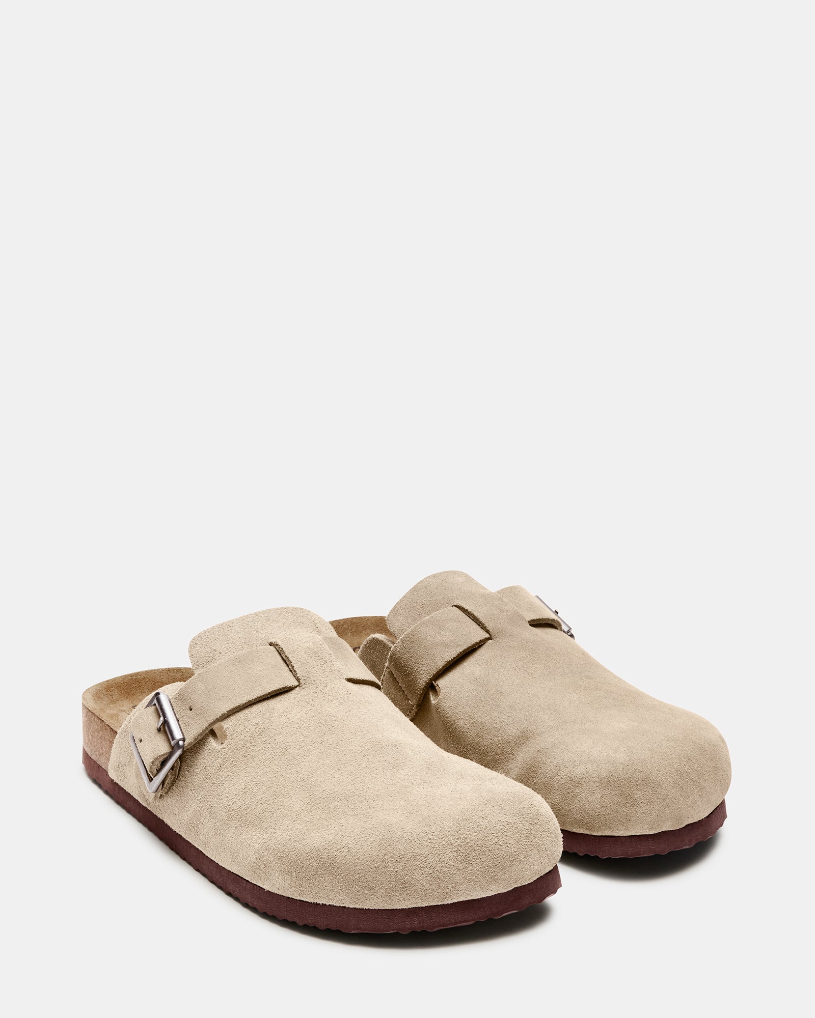 Lifestyle shot of casual loafers worn with jeans in an urban setting