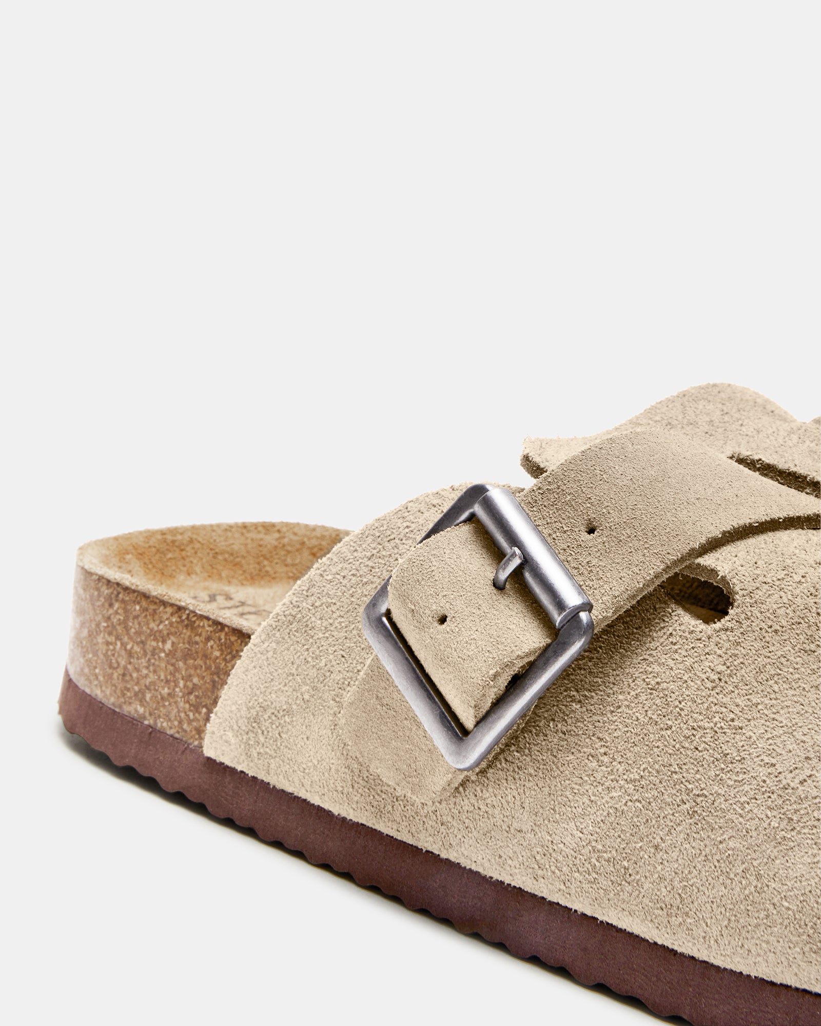 Side view of taupe suede mens slip-on shoes with adjustable buckle