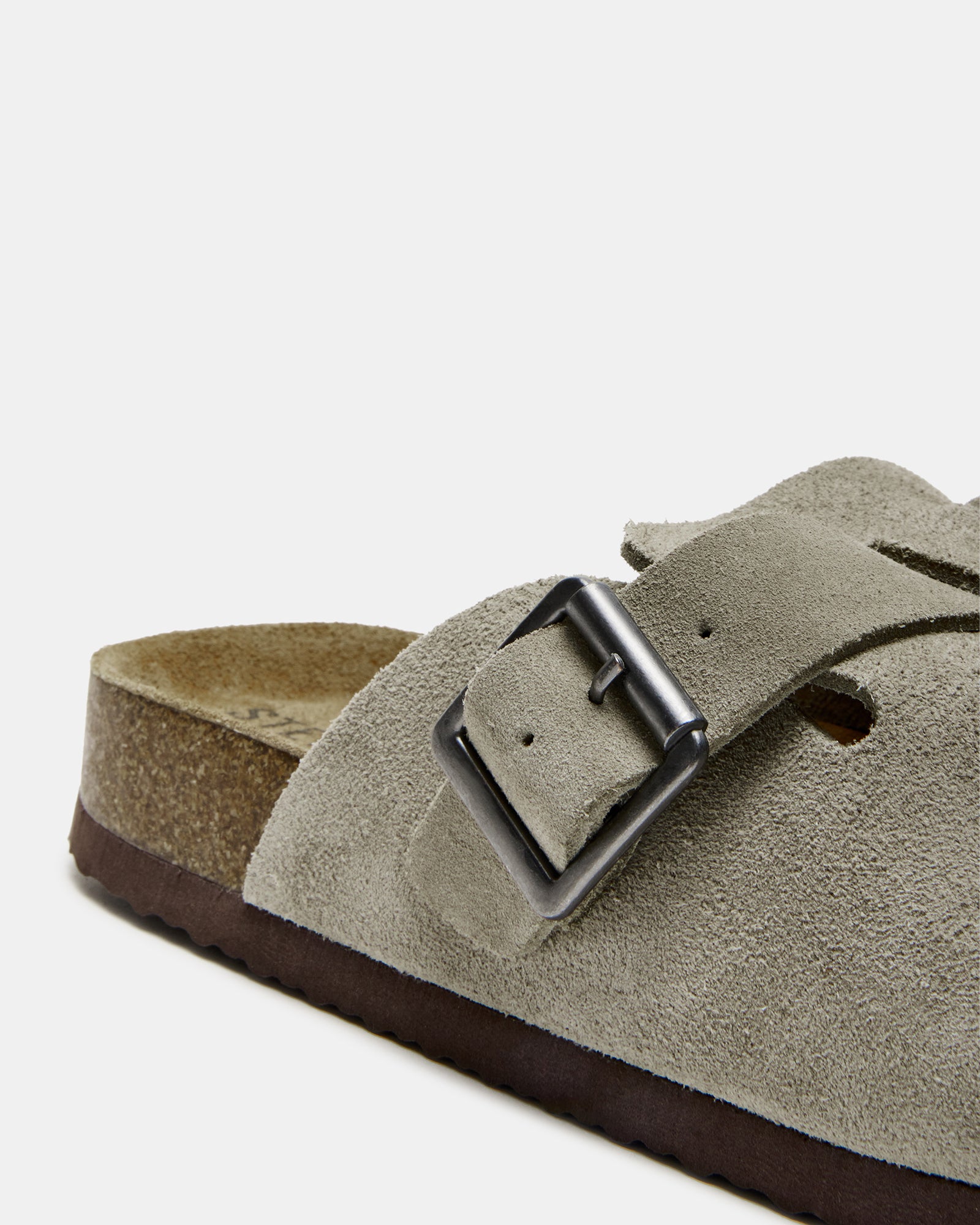 Close-up of Wilderr suede slides showing the soft footbed.