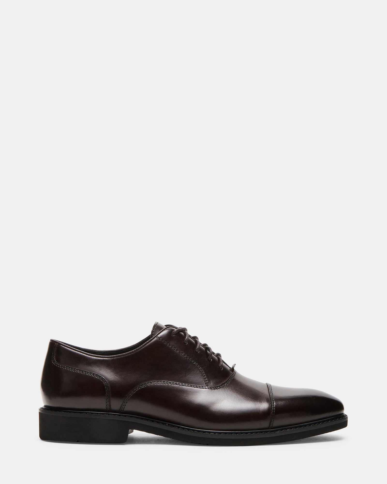 Front profile of brown leather shoes on polished floor for formal wear
