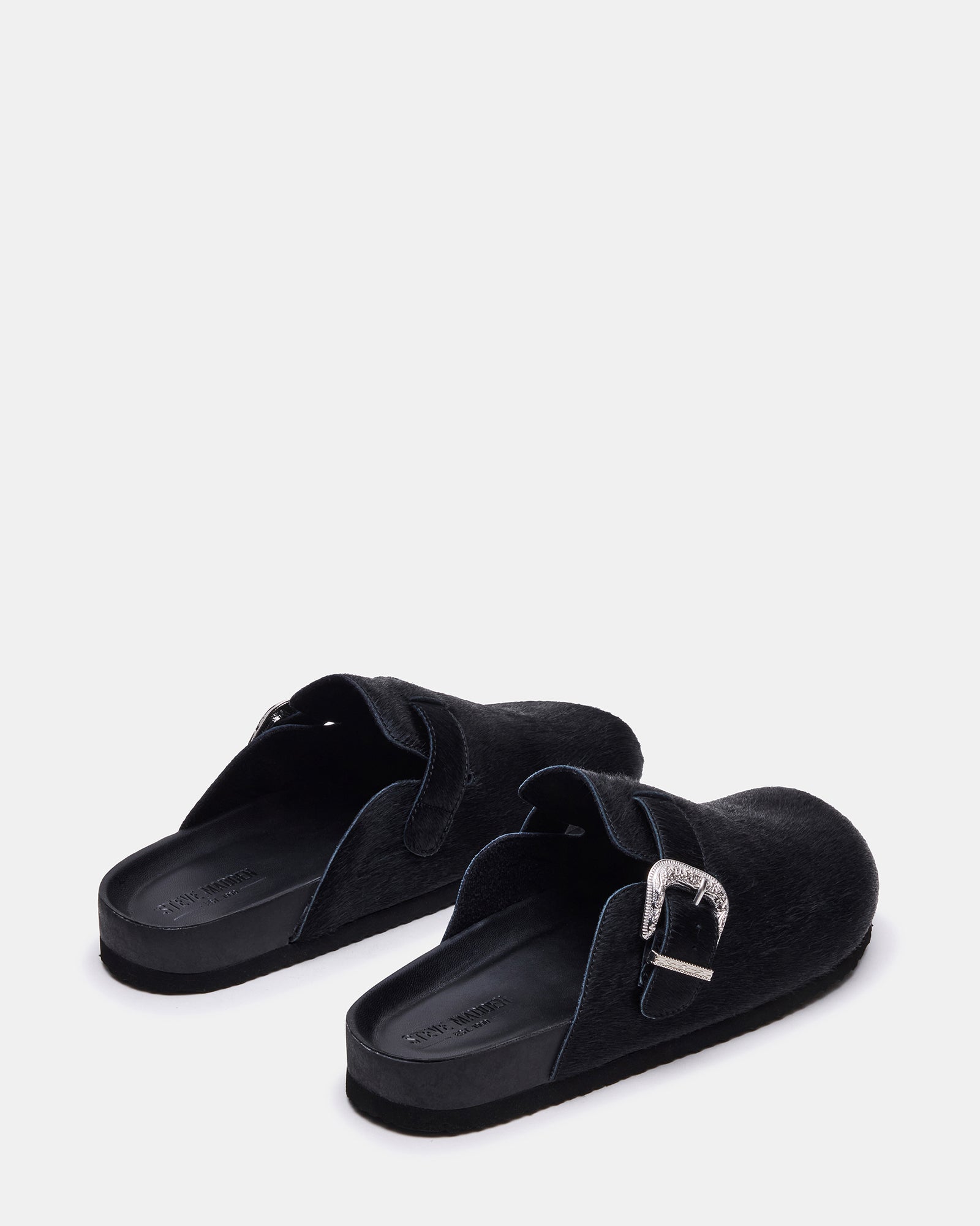 Close-up of western buckle detail on casual loafers