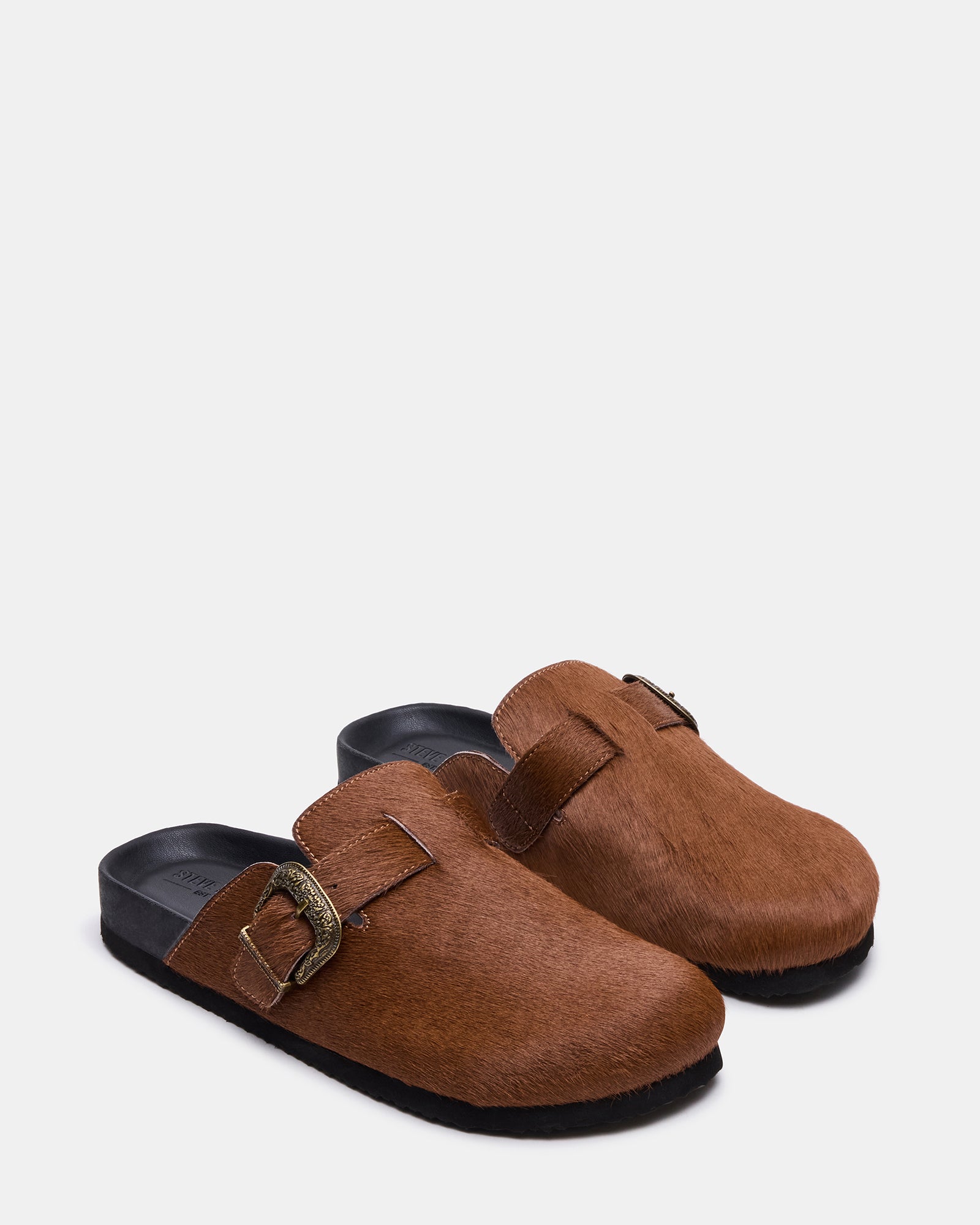 Side profile of casual slip-on shoes styled for comfort and charm