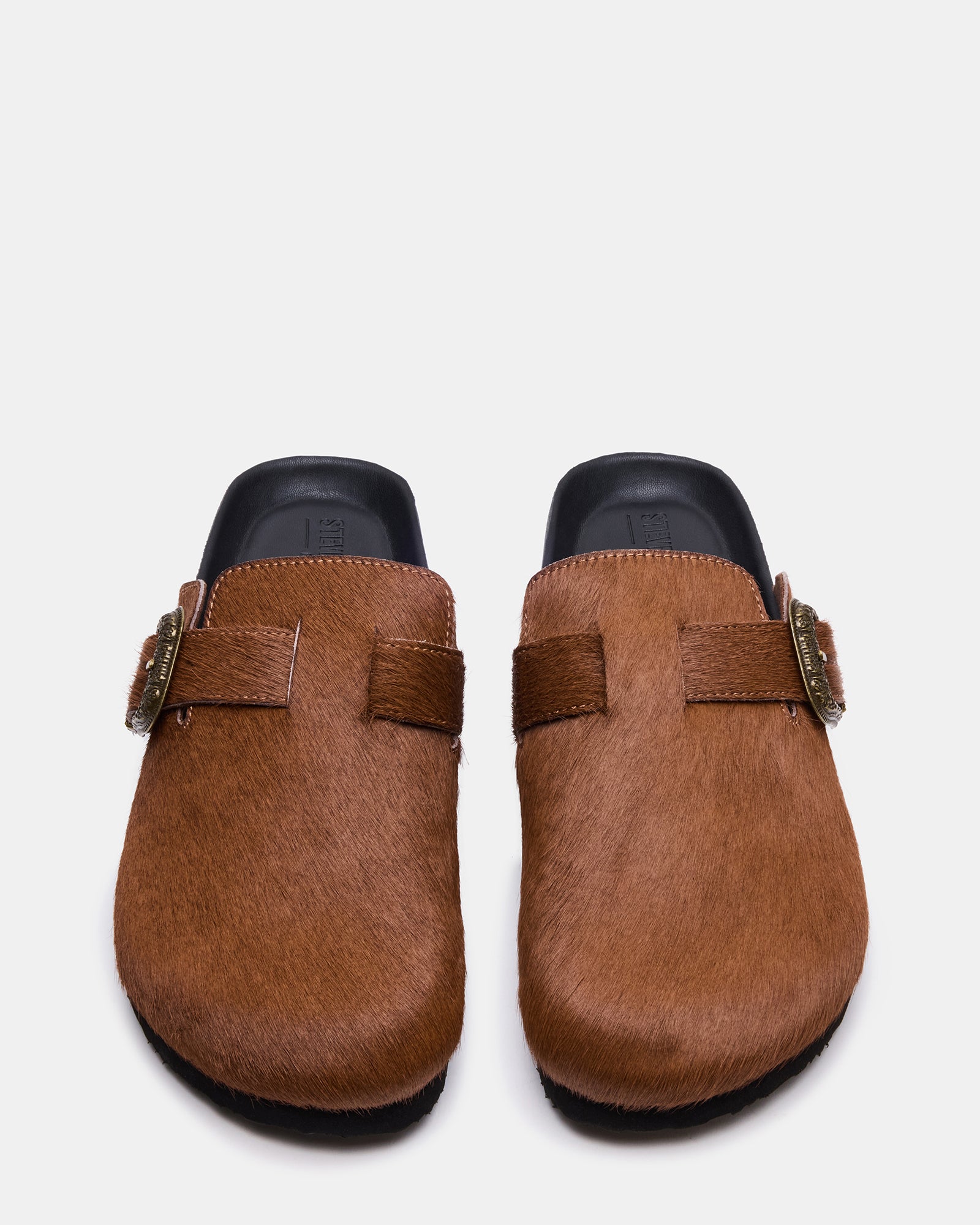 Angled view of mens shoes showing buckle and chestnut leather upper