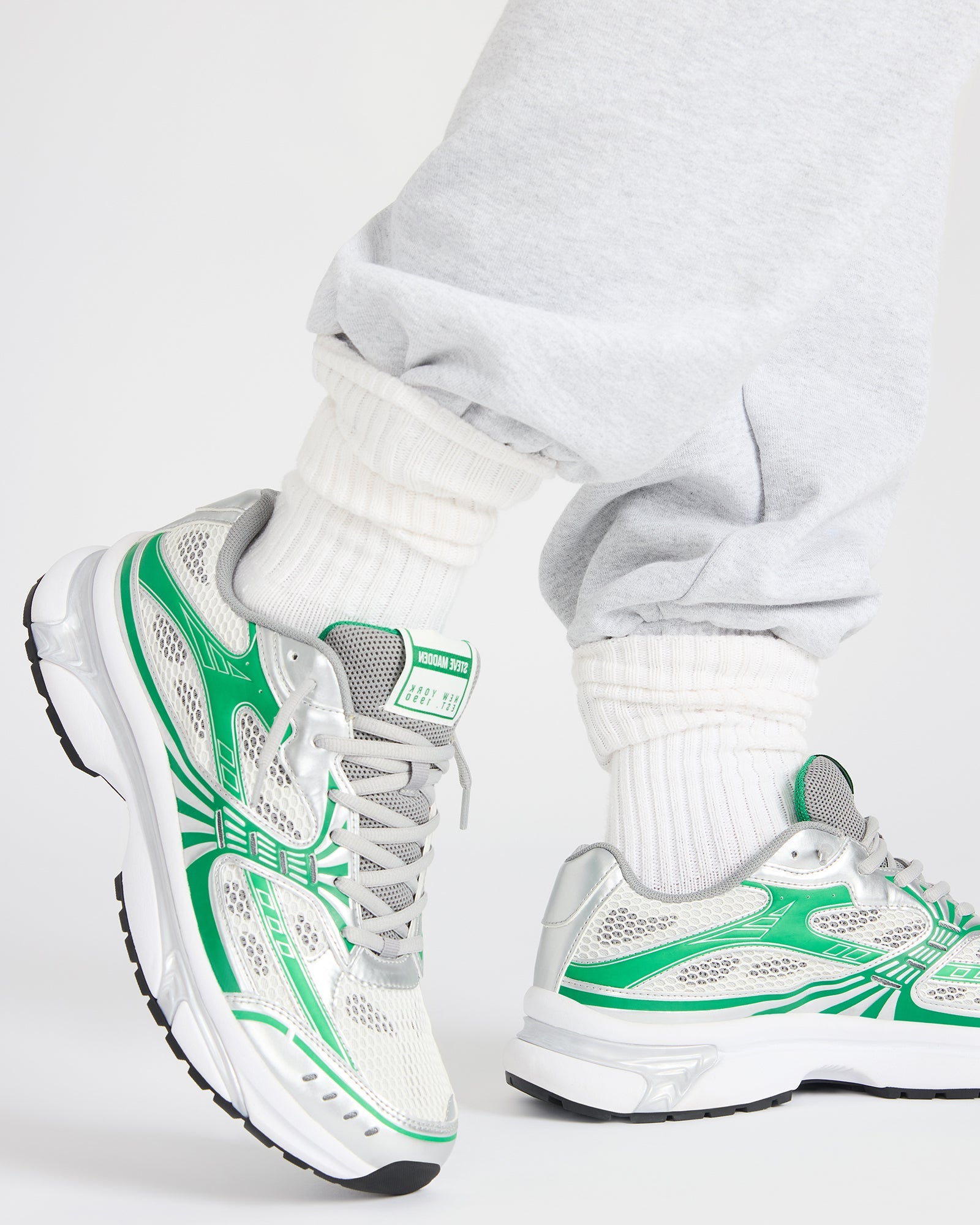 Close-up of lace-up closure and synthetic upper on casual sneakers