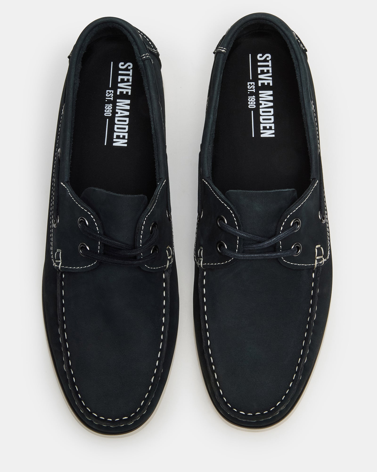 Side view of navy sperry boat shoes styled with summer chinos