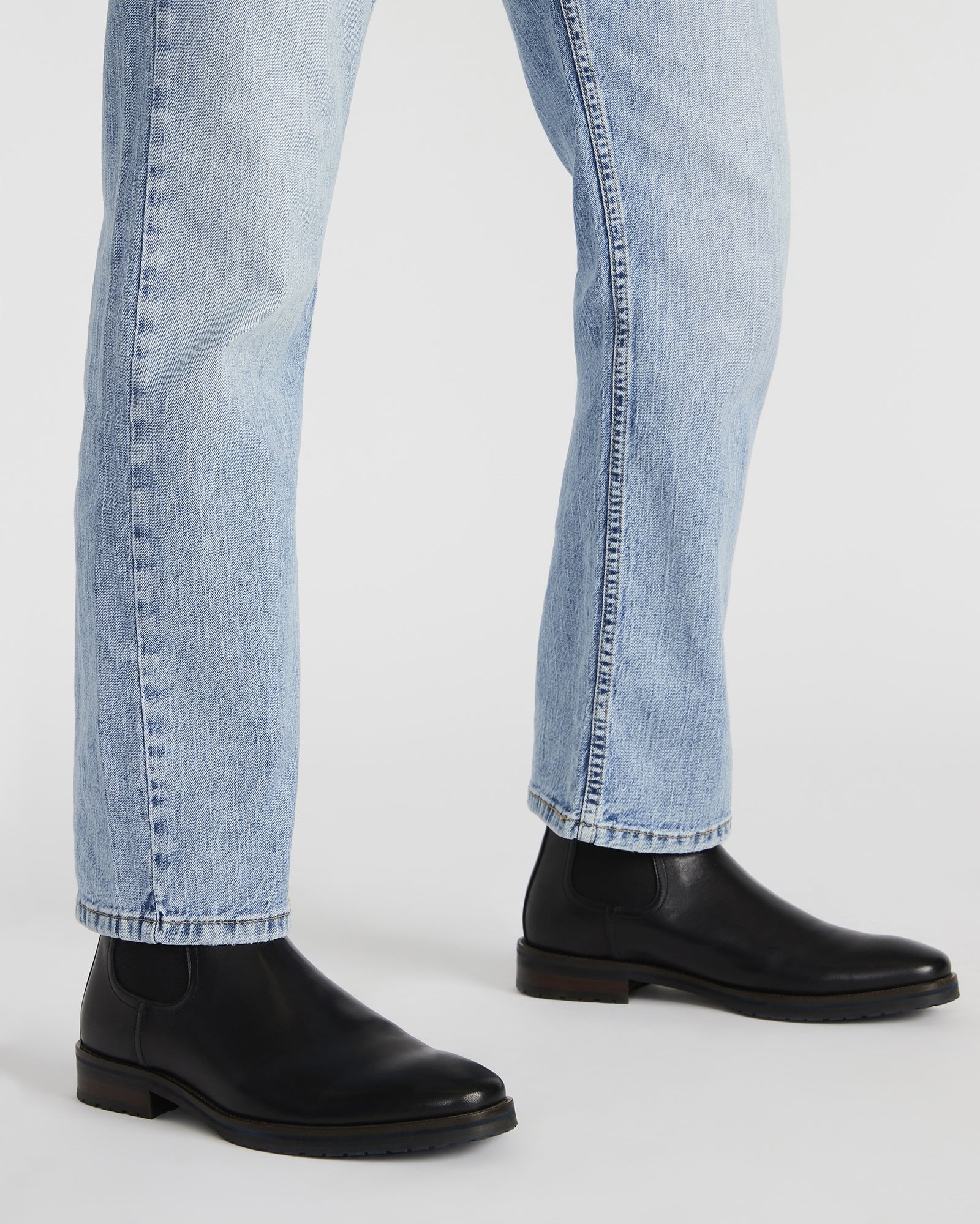 Rear view highlighting pull tab and heel detail on men boots leather black