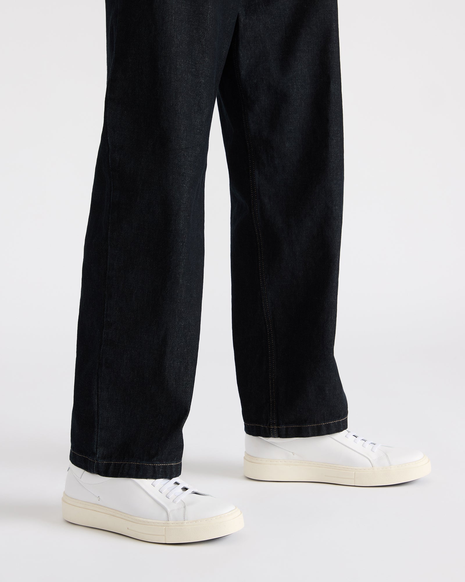 Close-up of the lace-up closure on ZOII white sneakers for everyday style