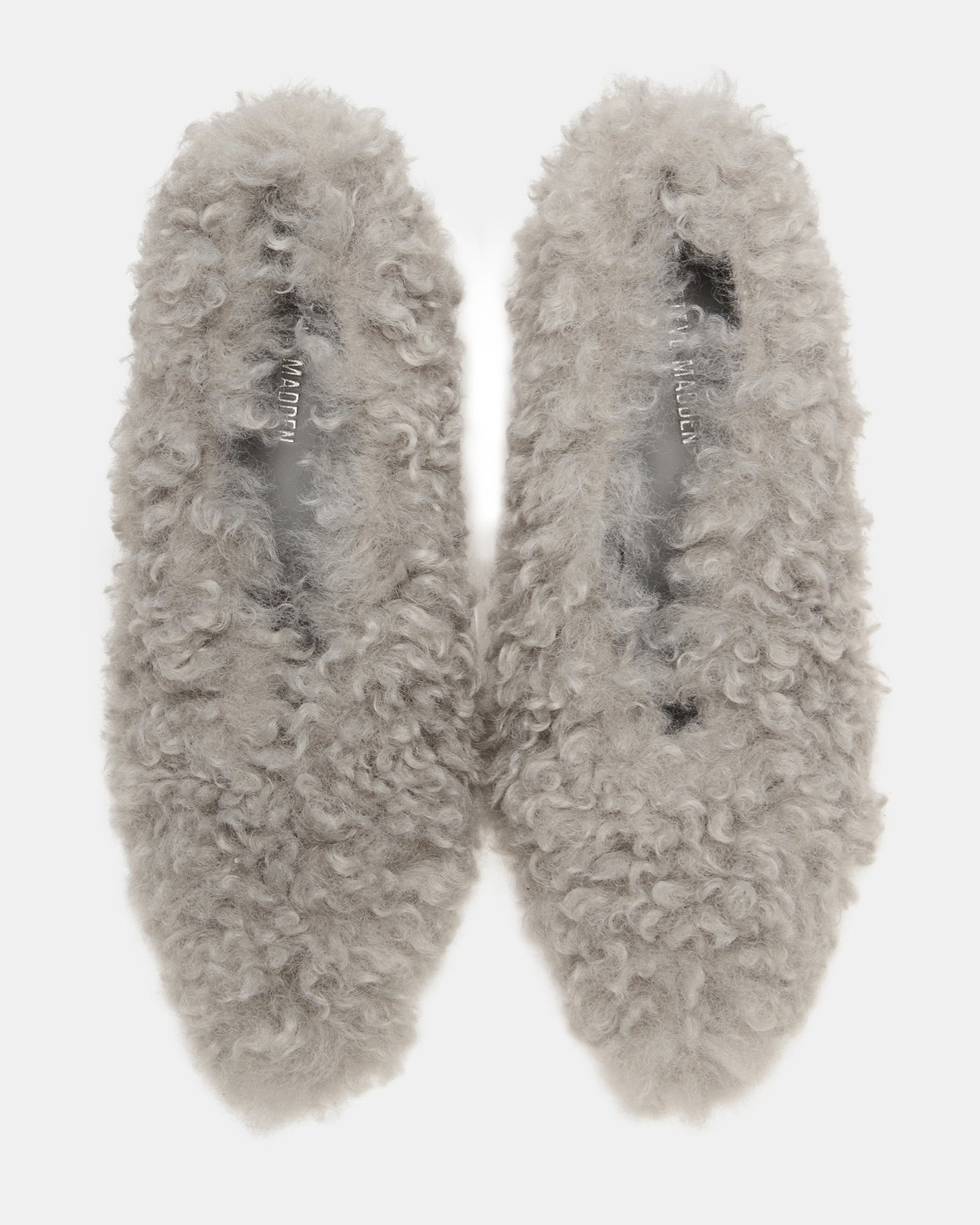 Close-up of faux fur shoes with pointed toe and stiletto heel in light blue finish