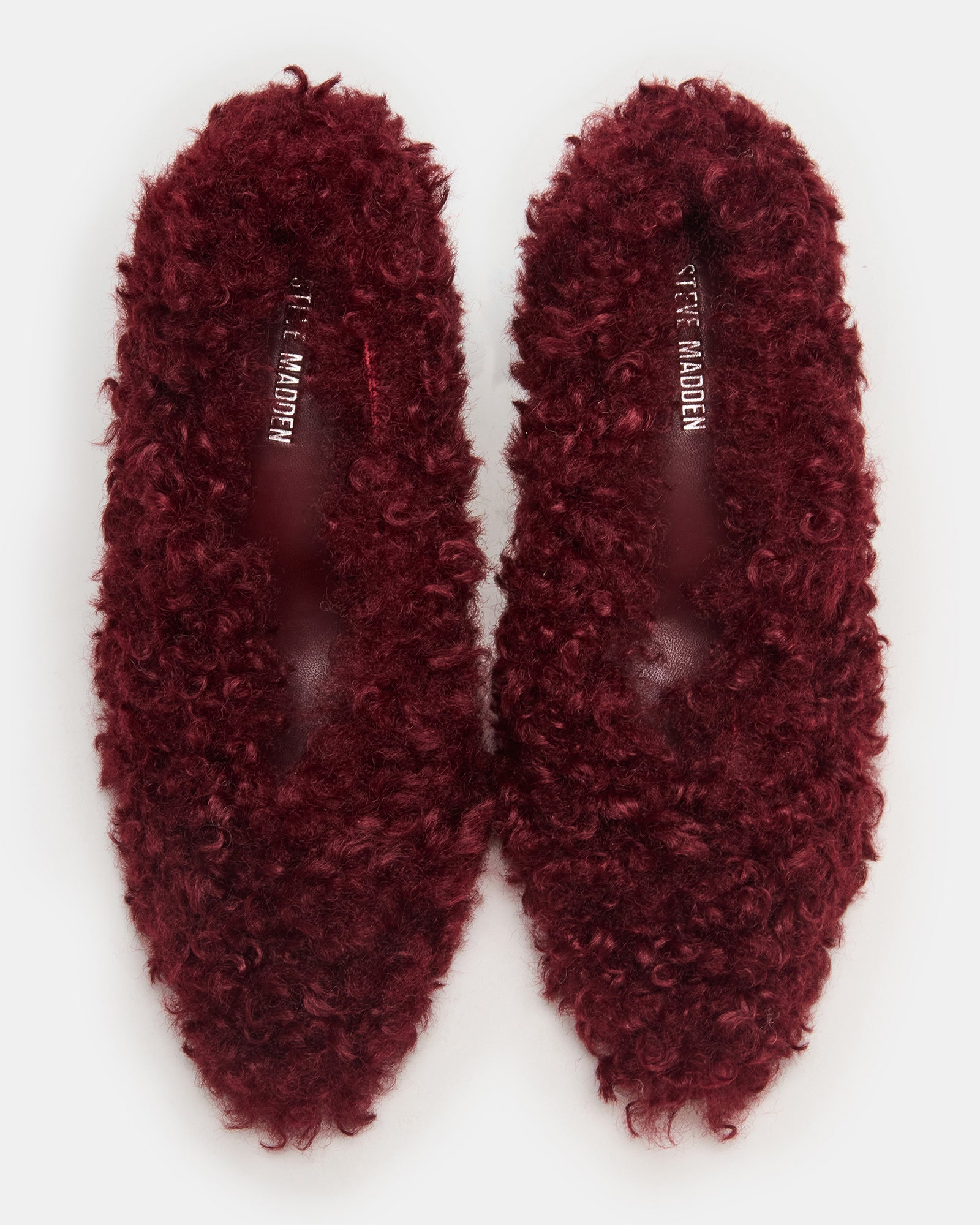Achilles red stiletto heels with pointed toe and faux fur trim, perfect for evening wear.