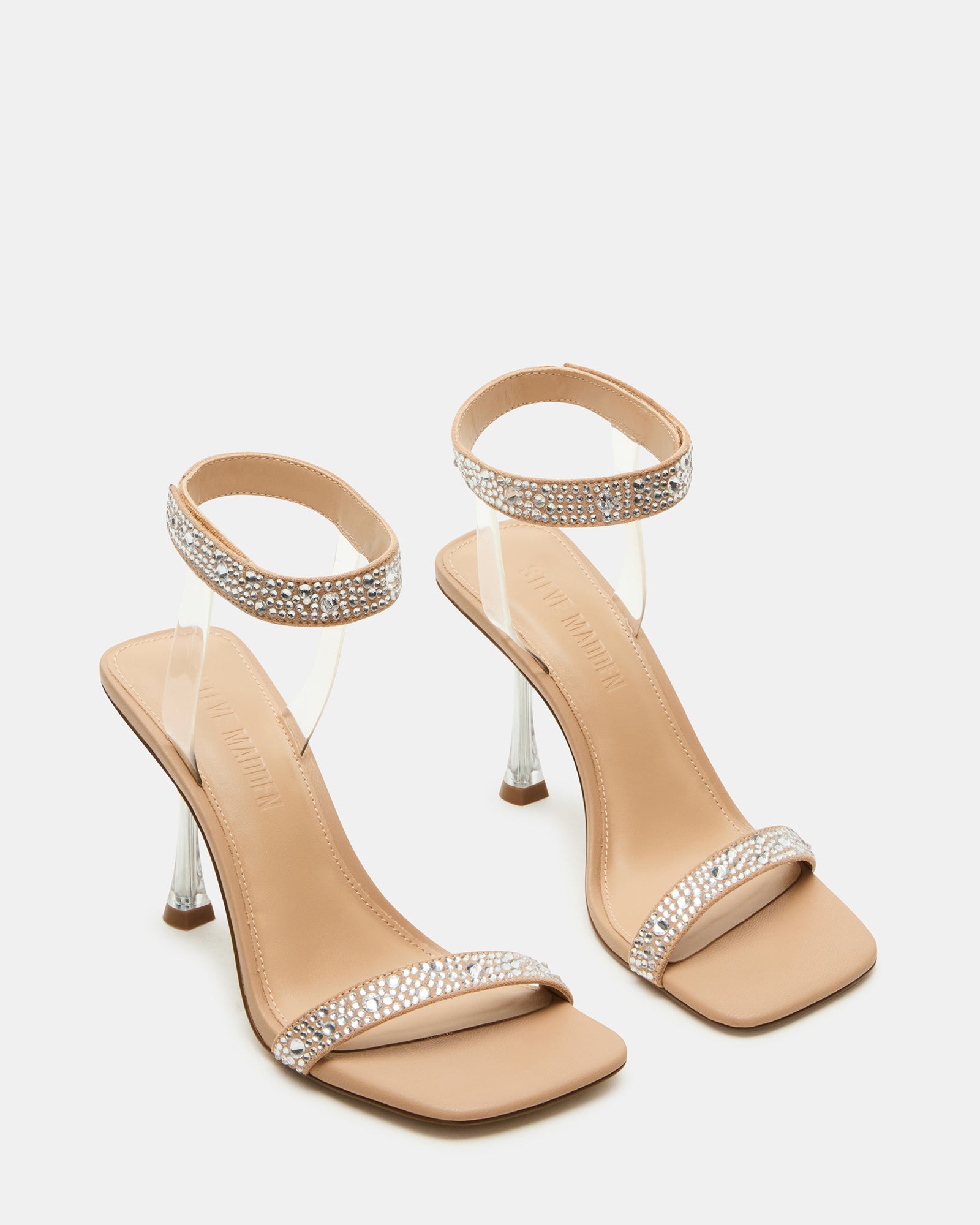 Gold rhinestone heels shown from side angle, highlighting ankle strap comfort