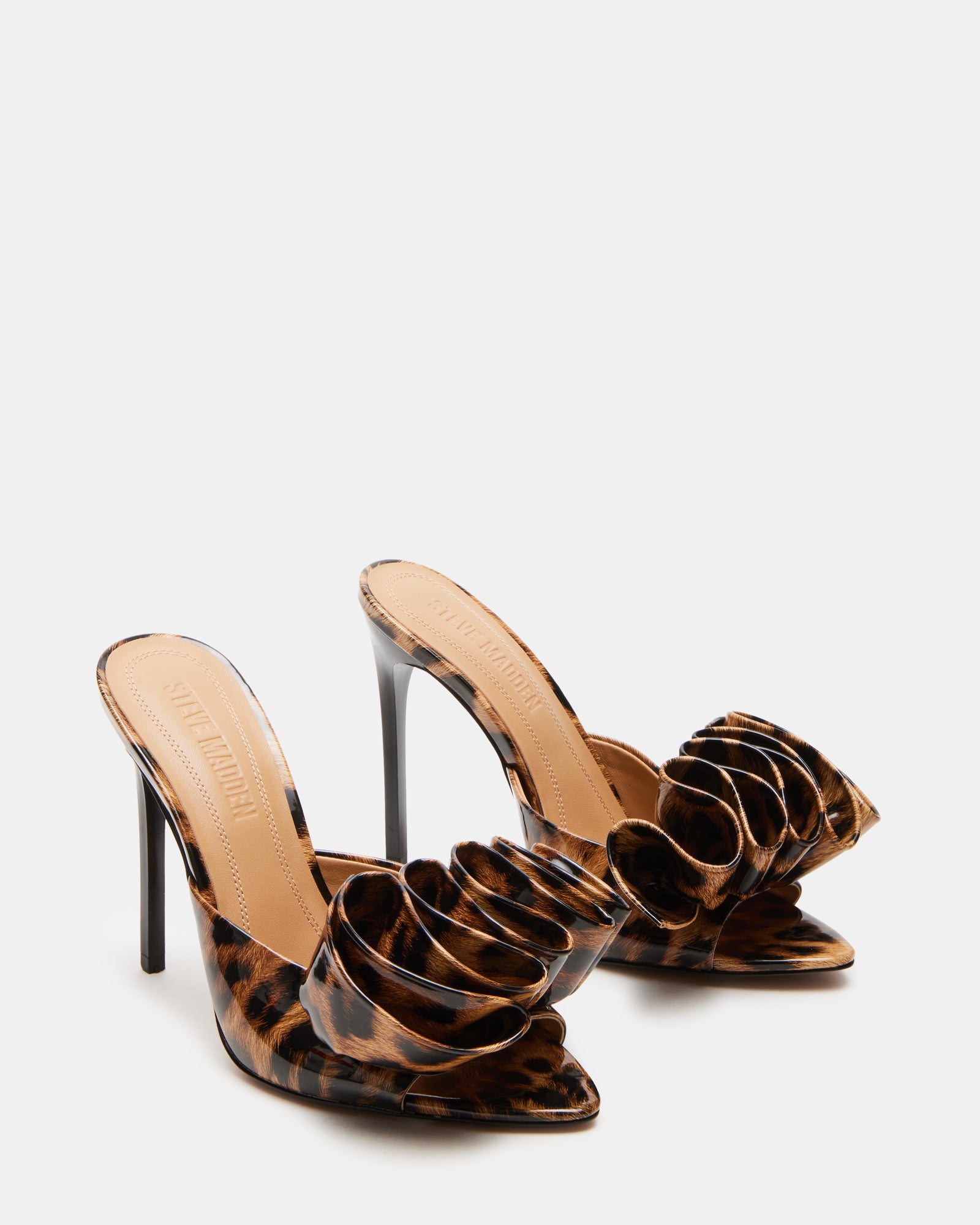 Side profile of stiletto mules showing heel height and slip-on fit