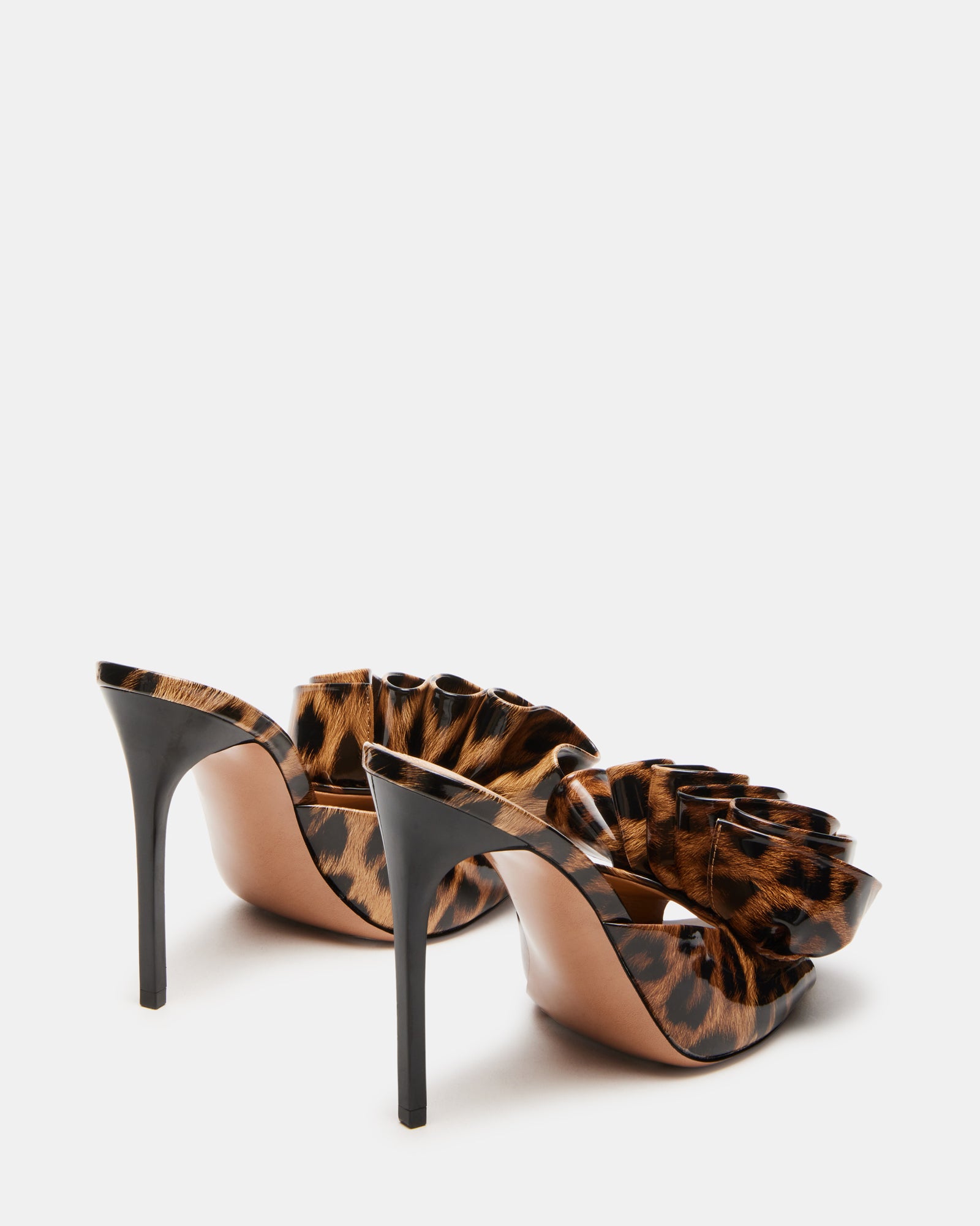 Side profile of stiletto mules showing heel height and slip-on fit