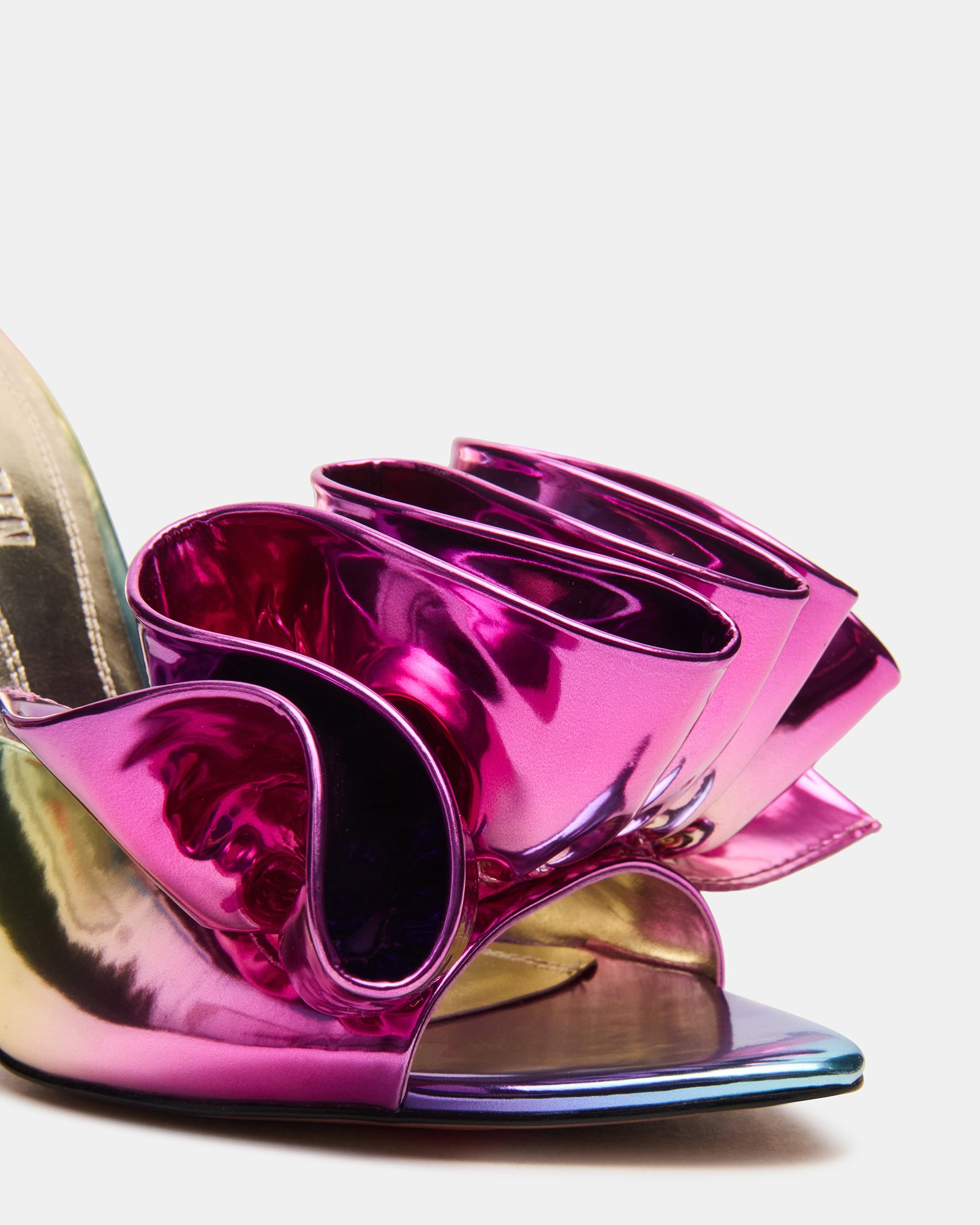 Close-up of Affinity metallic mule heels highlighting the sleek design.