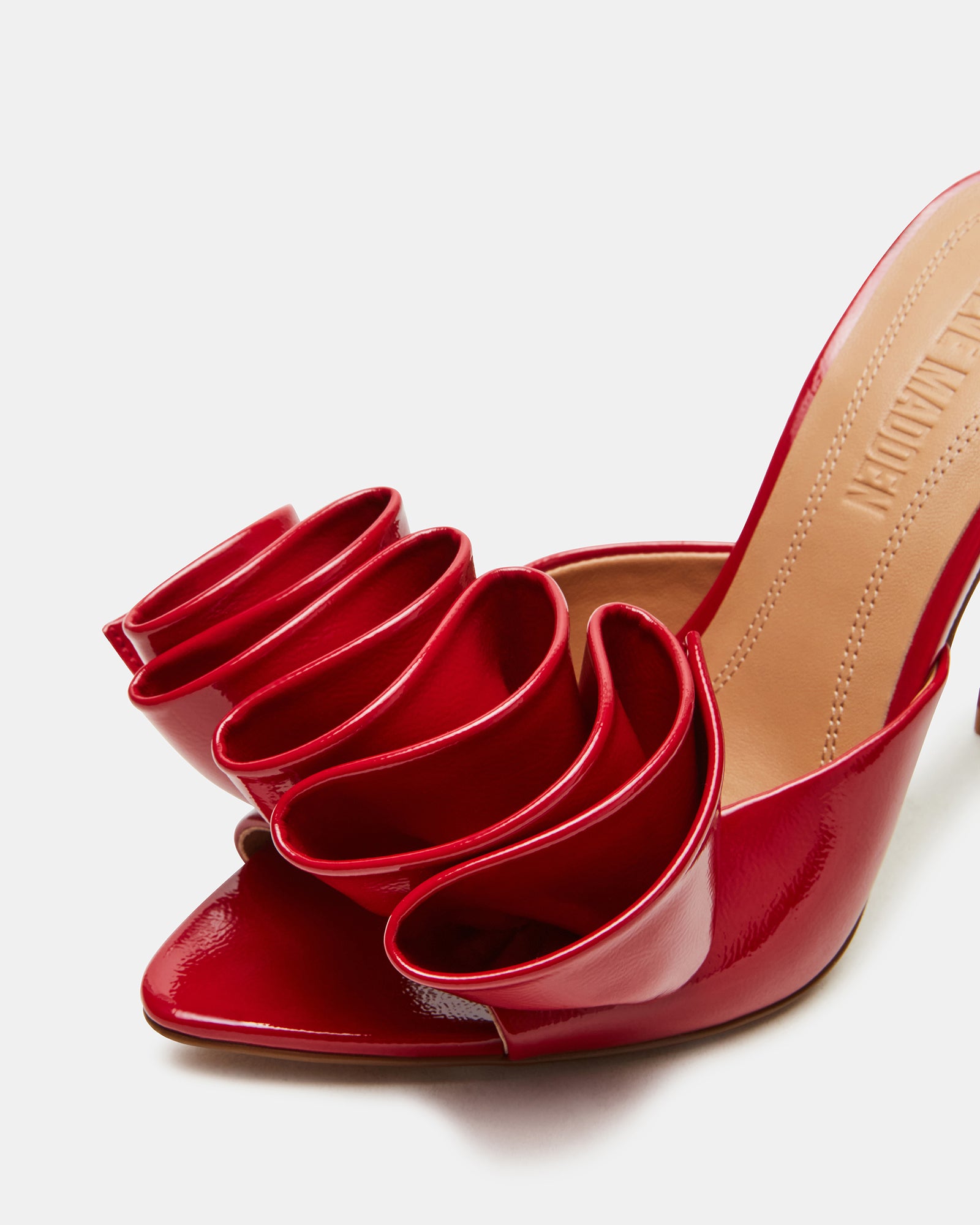 Red patent stiletto heels with pointed toe and slim heel, ideal for evening wear