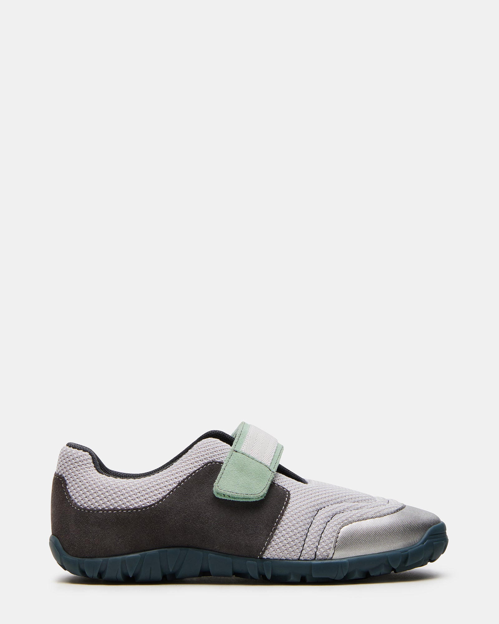 Close-up of silver Velcro Mary Jane sneakers showcasing the rounded toe design.