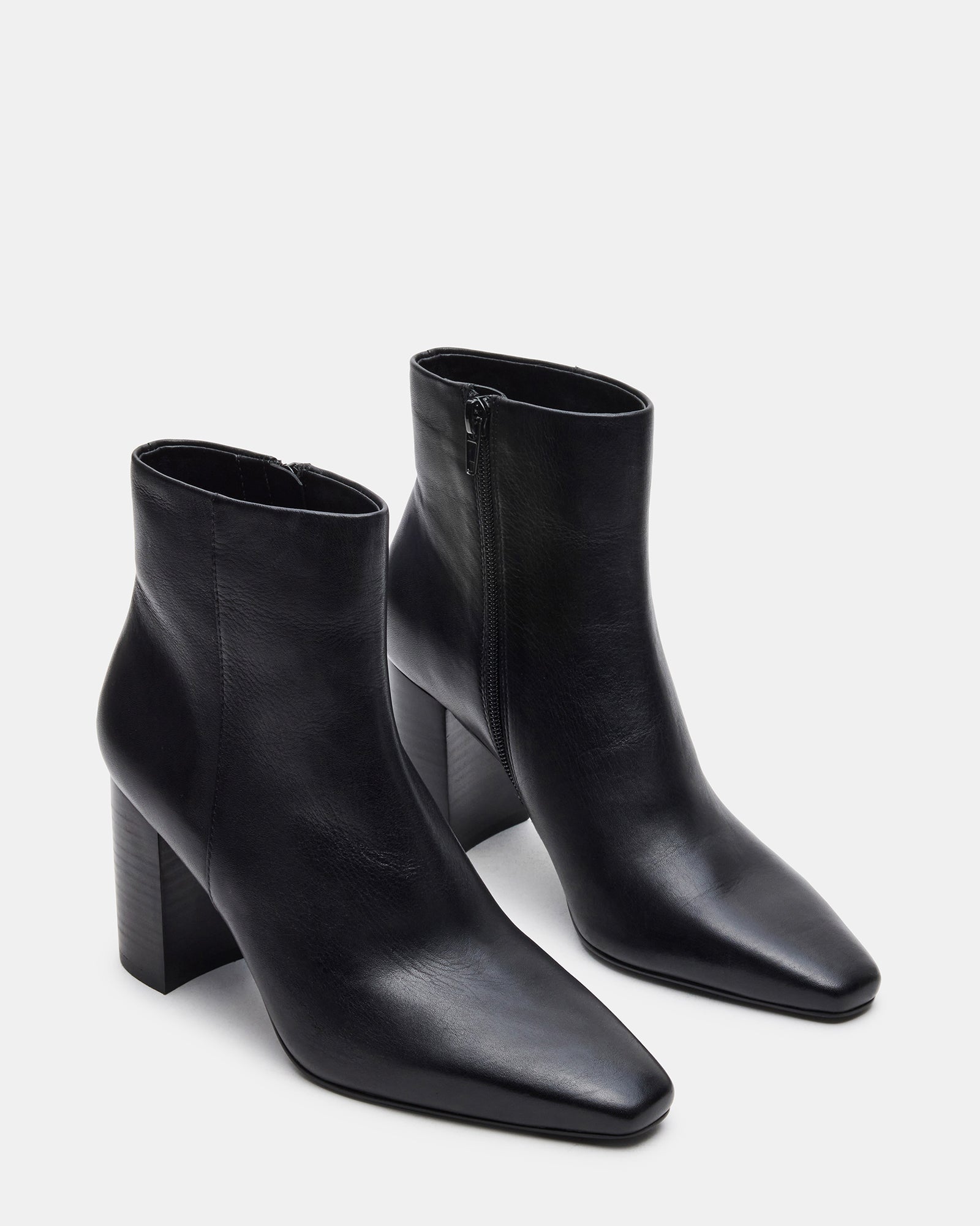 Close-up of the leather upper of Aidan black ankle boots highlighting the quality craftsmanship.