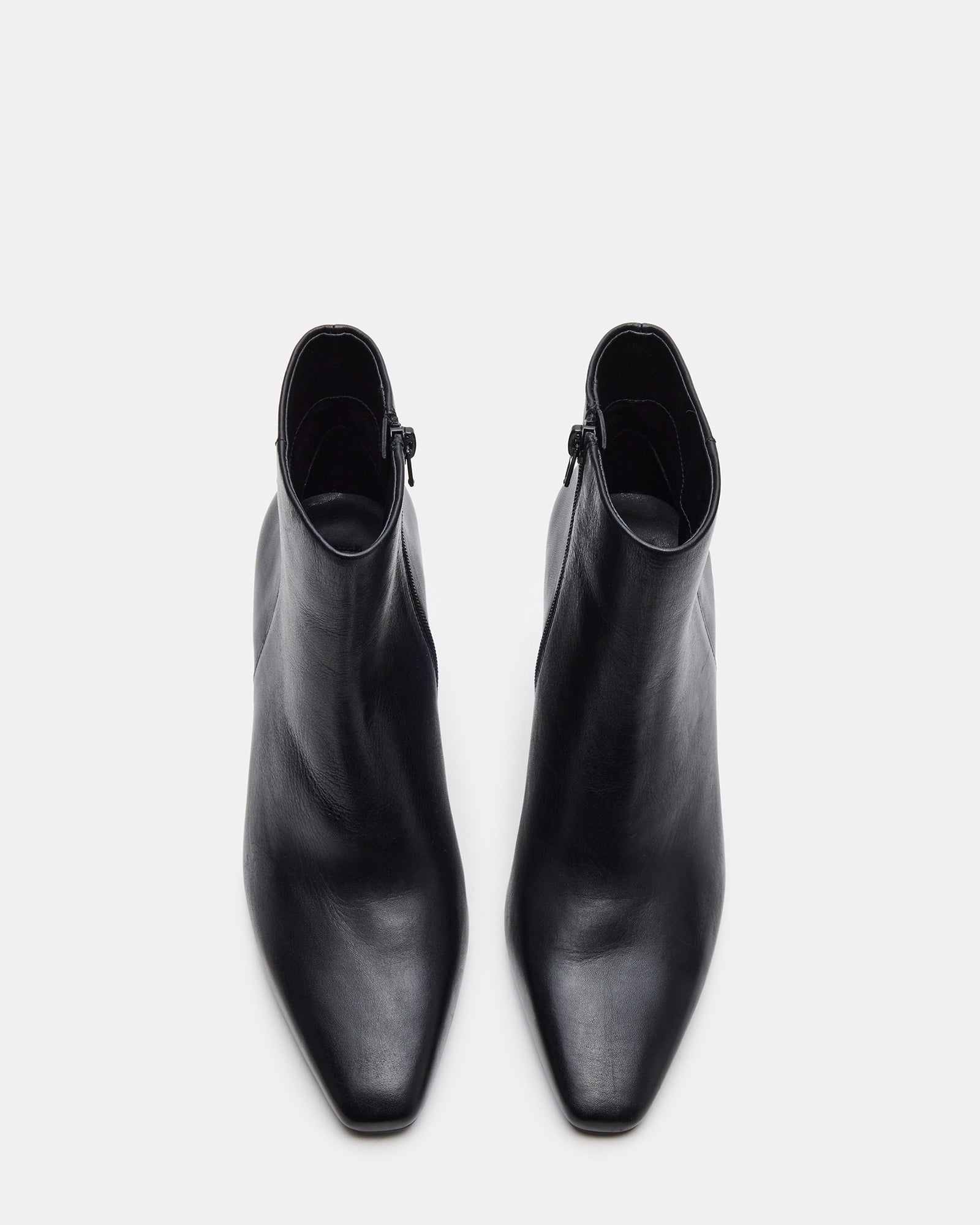 Aidan black block high heel shoes styled with casual outfits for a chic look.