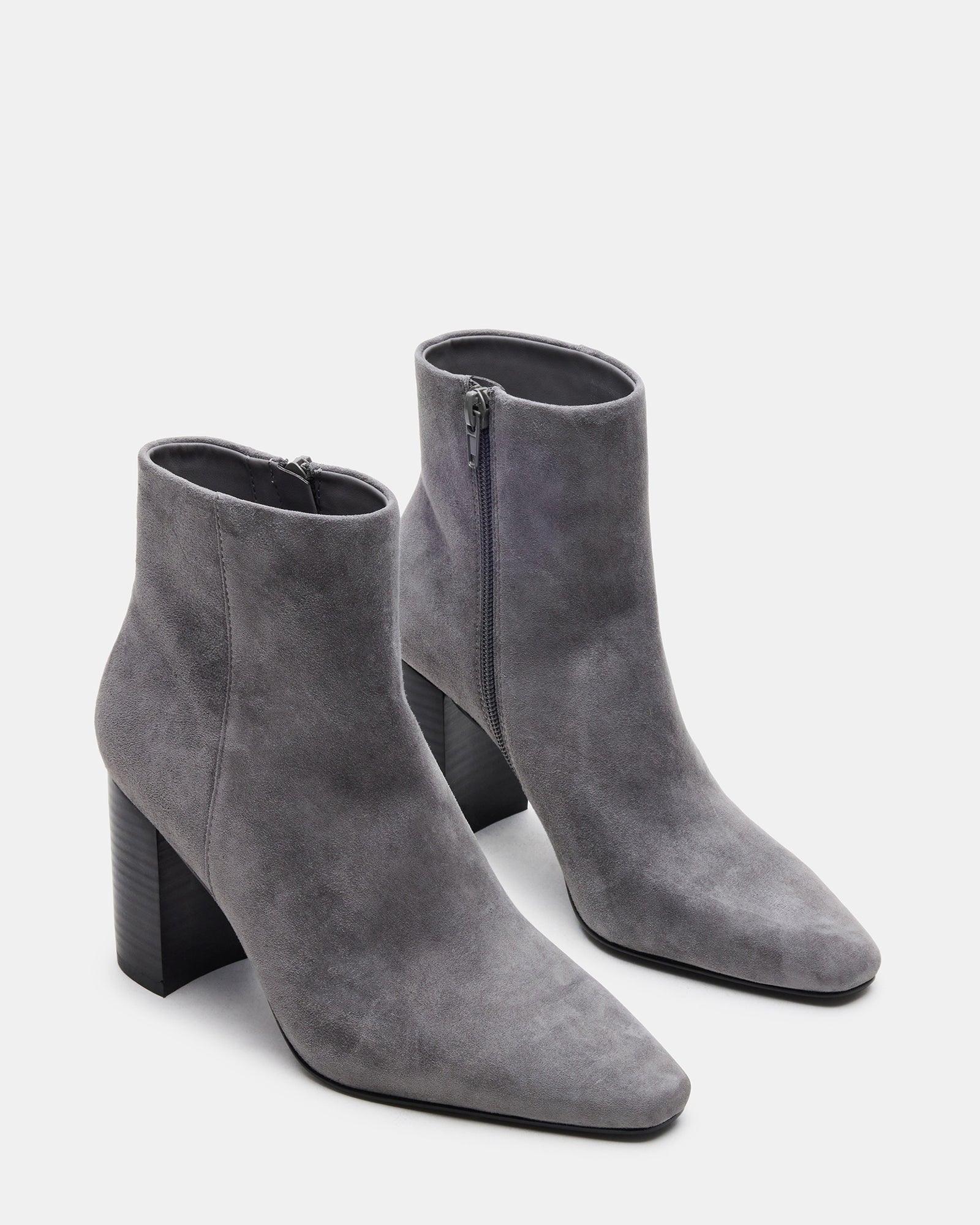 Close-up of the square toe design on the suede booties.