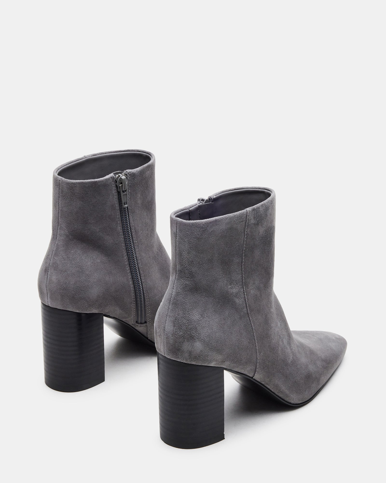 Close-up of the square toe design on the suede booties.