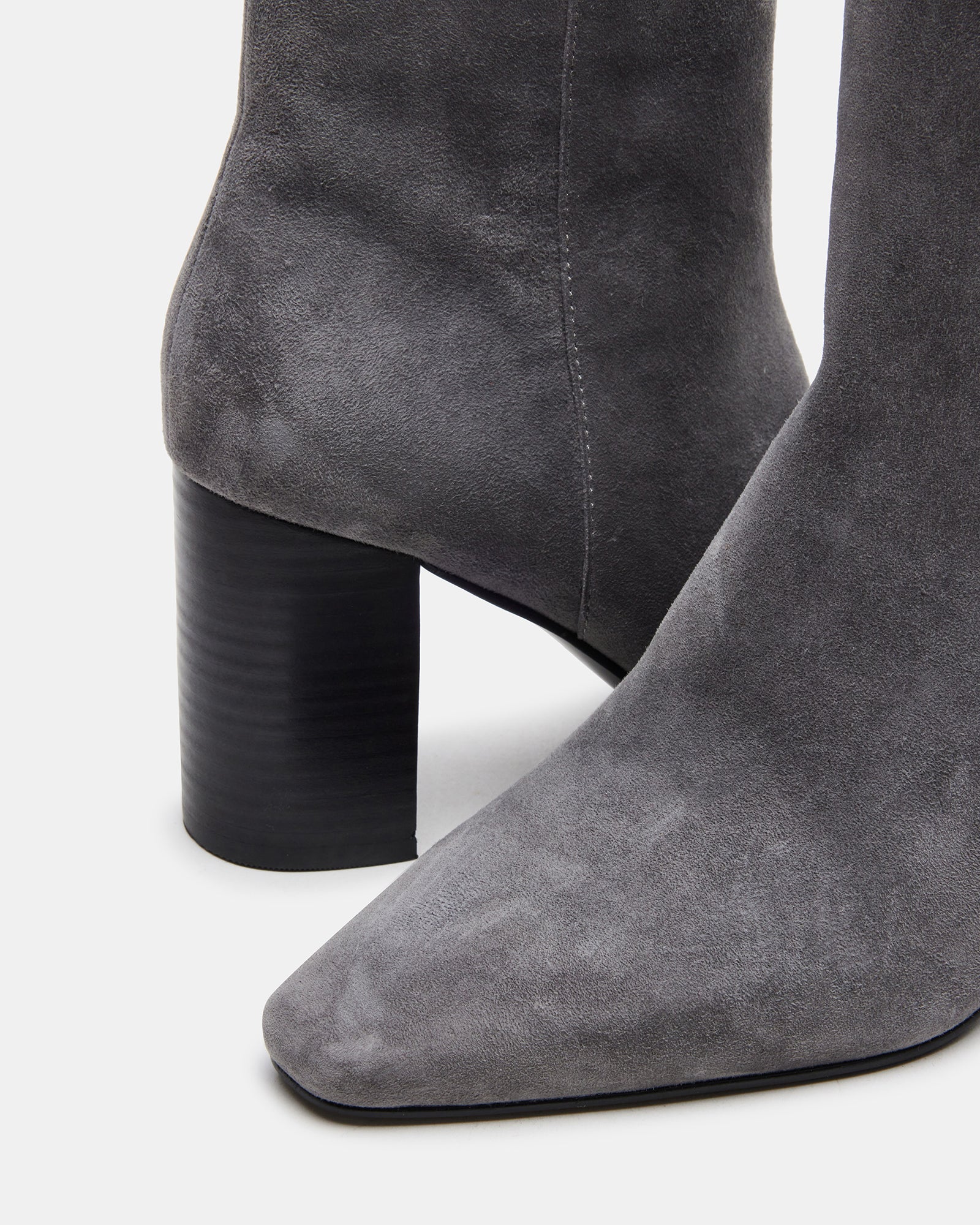 Aidan Grey block heel booties worn on a stylish outfit.