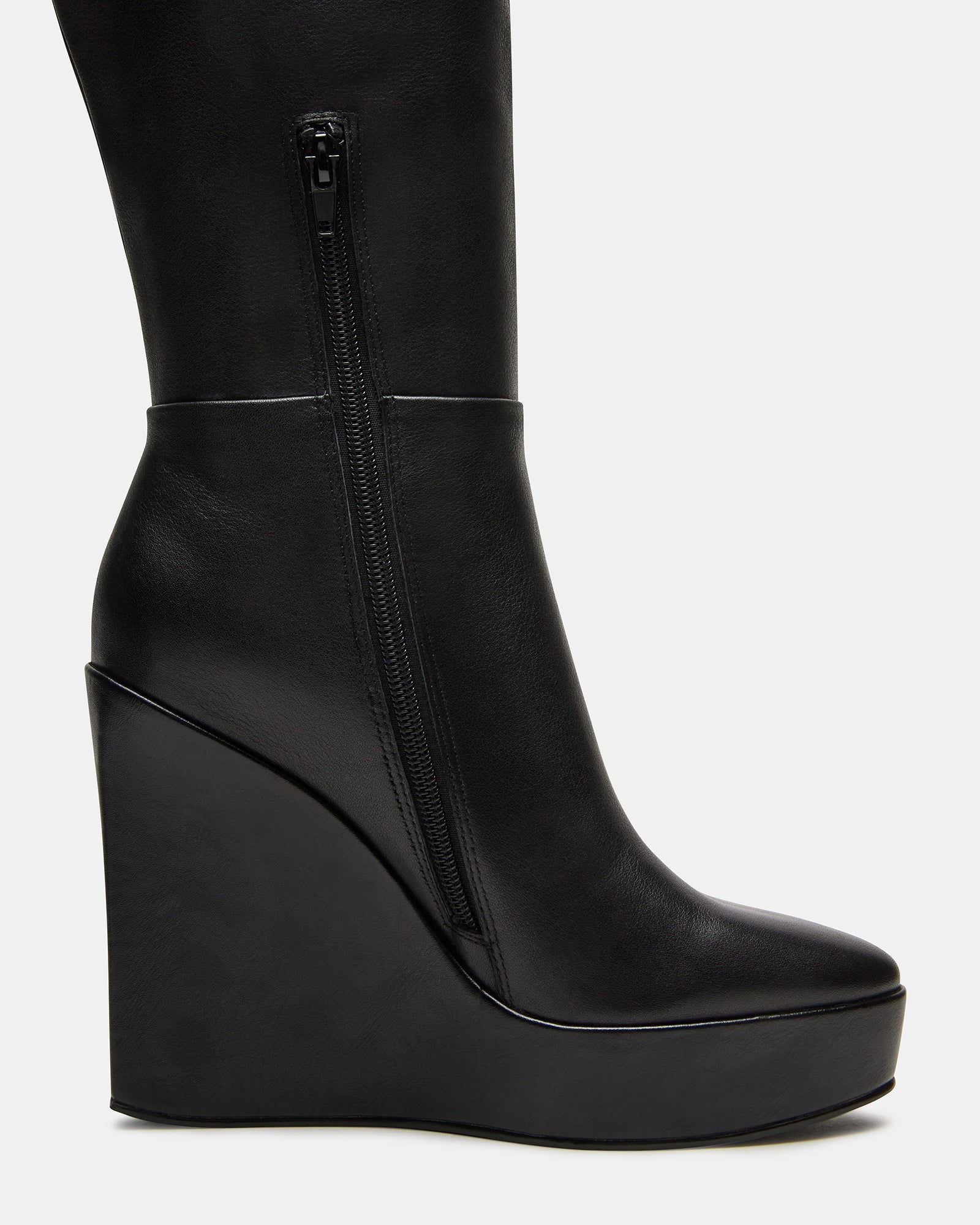 Front view showcasing the structured black leather design of knee high boots