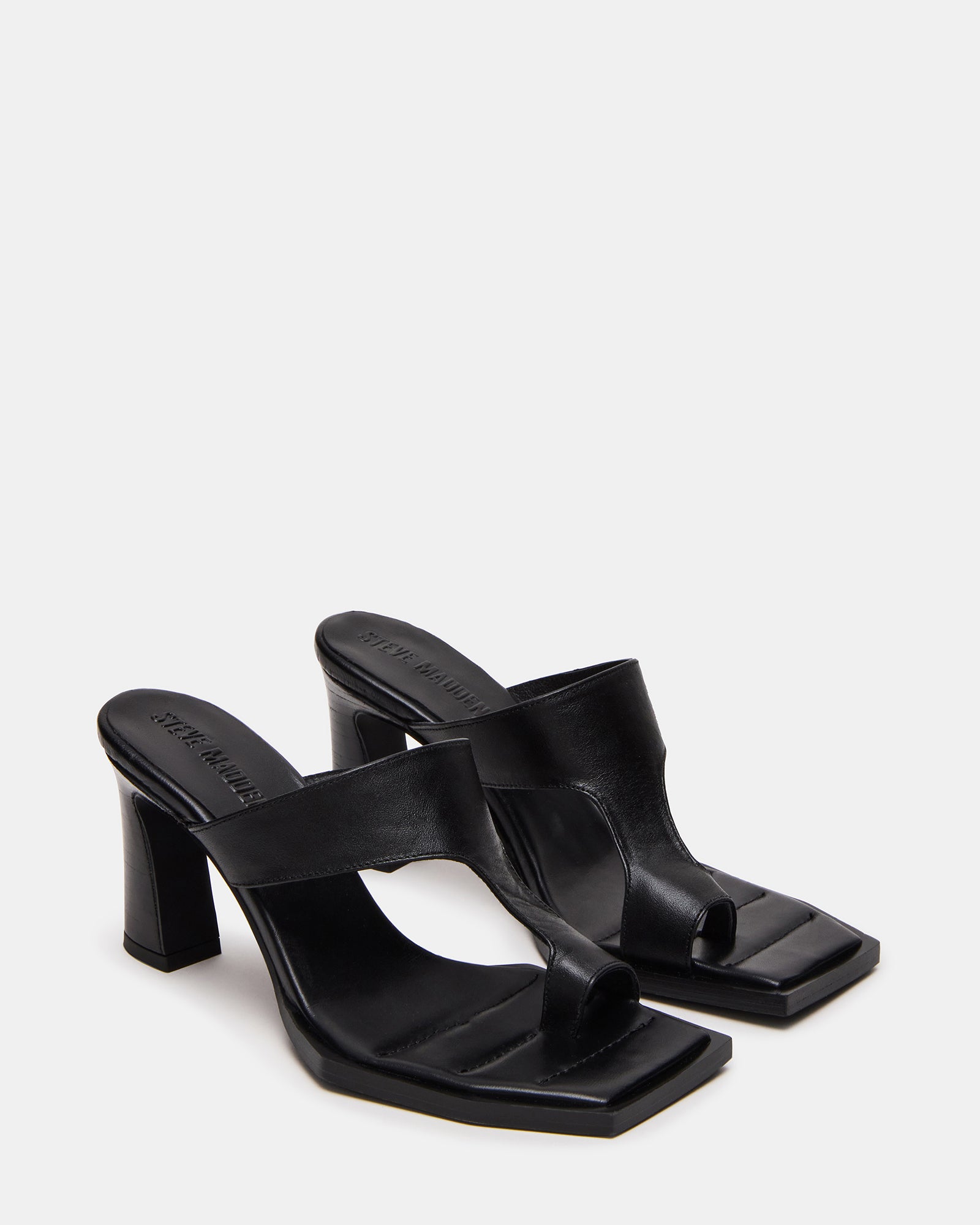 Square toe mules showcased during indoor brunch setting