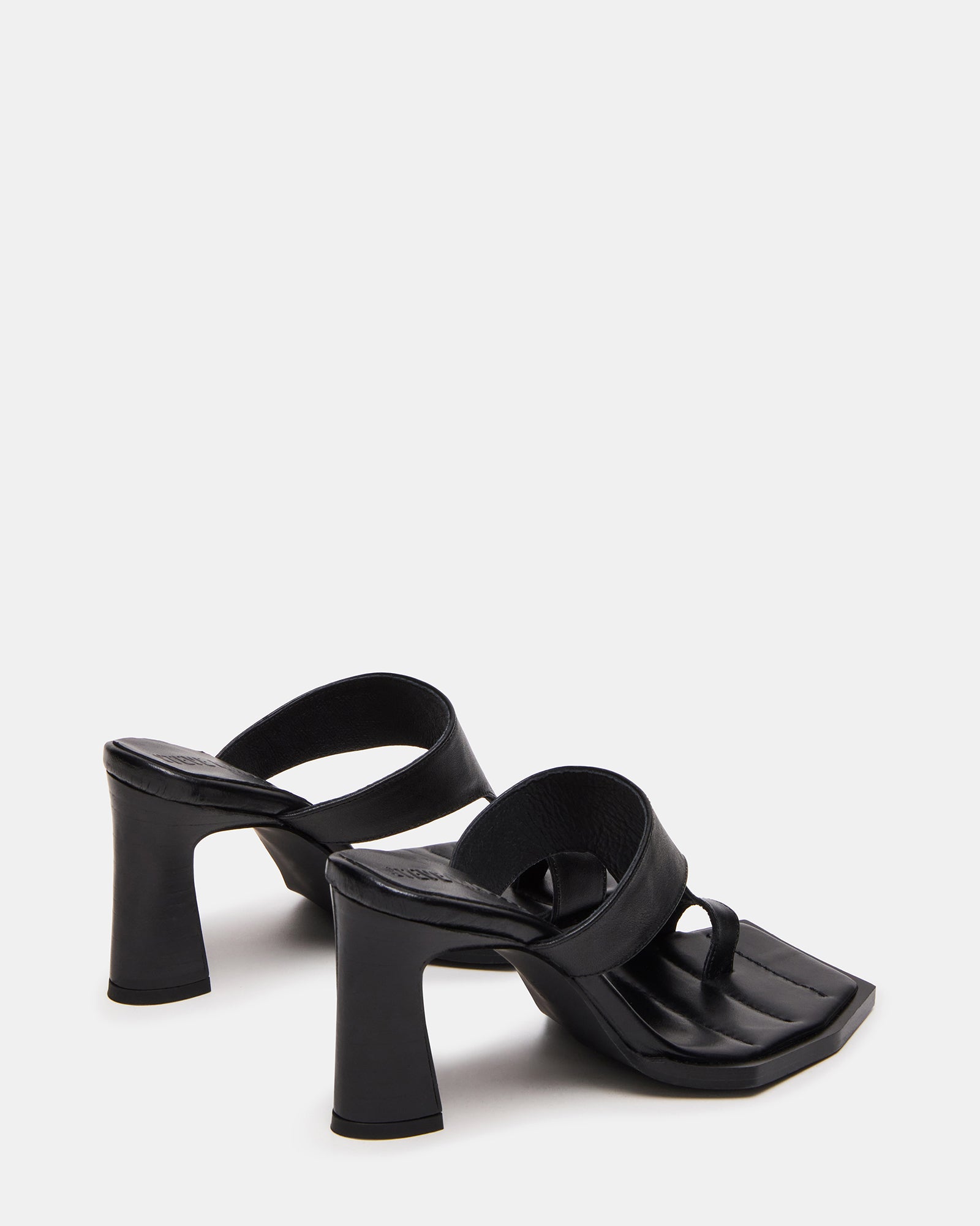 Square toe mules showcased during indoor brunch setting