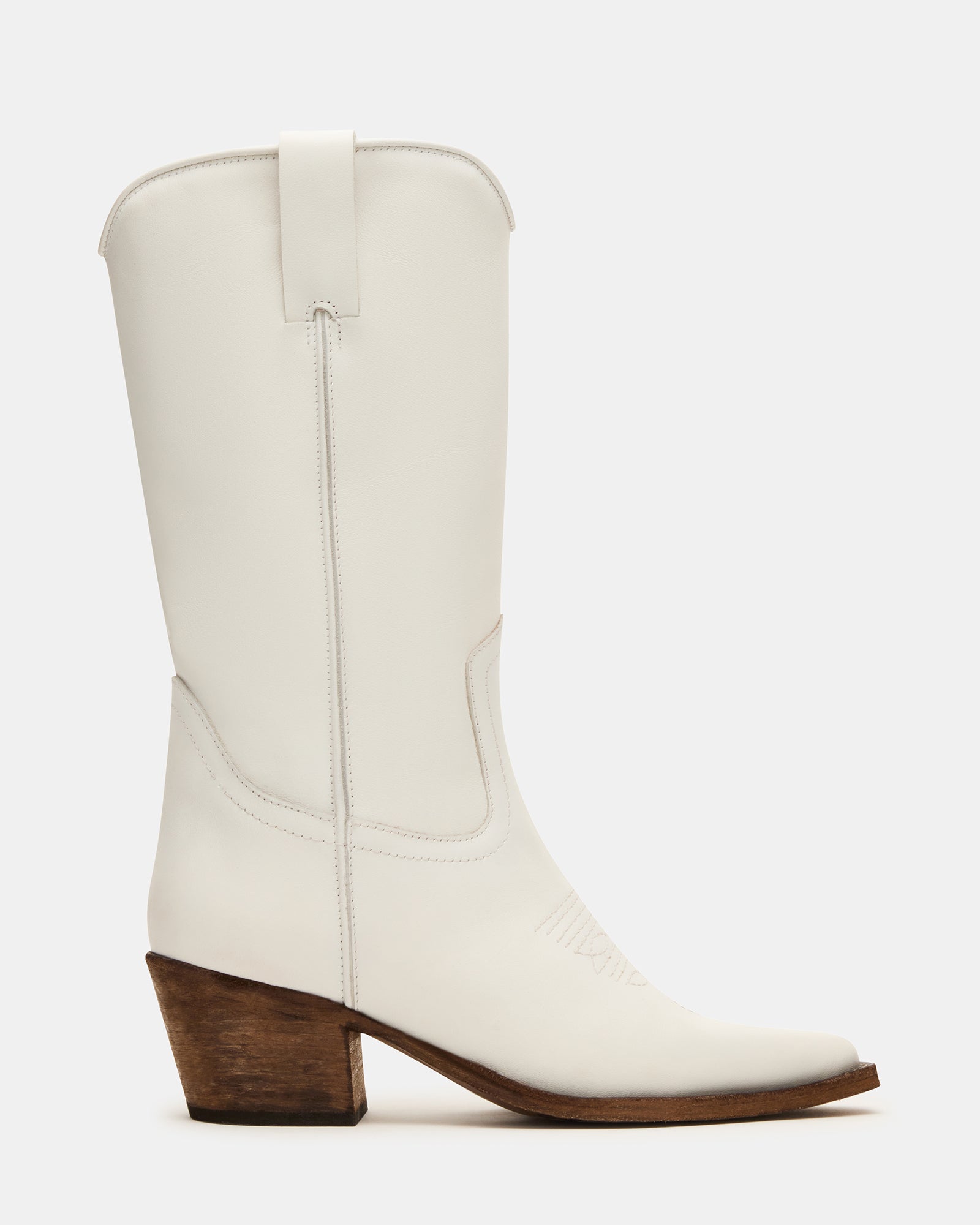 Men's pointed toe boots on rustic porch with sunlight