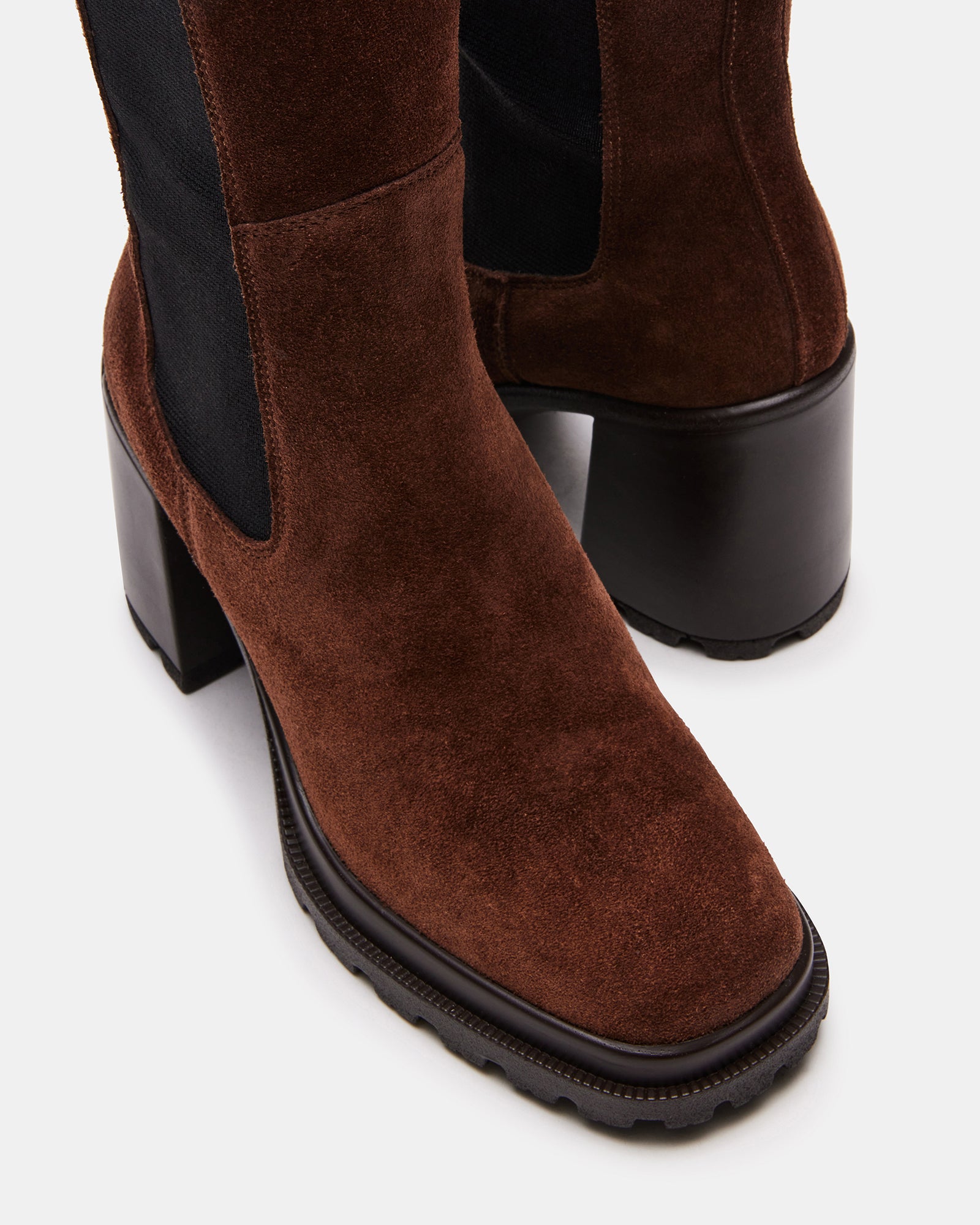 Close-up of ALESTI brown suede knee high boots showing square toe and textured sole