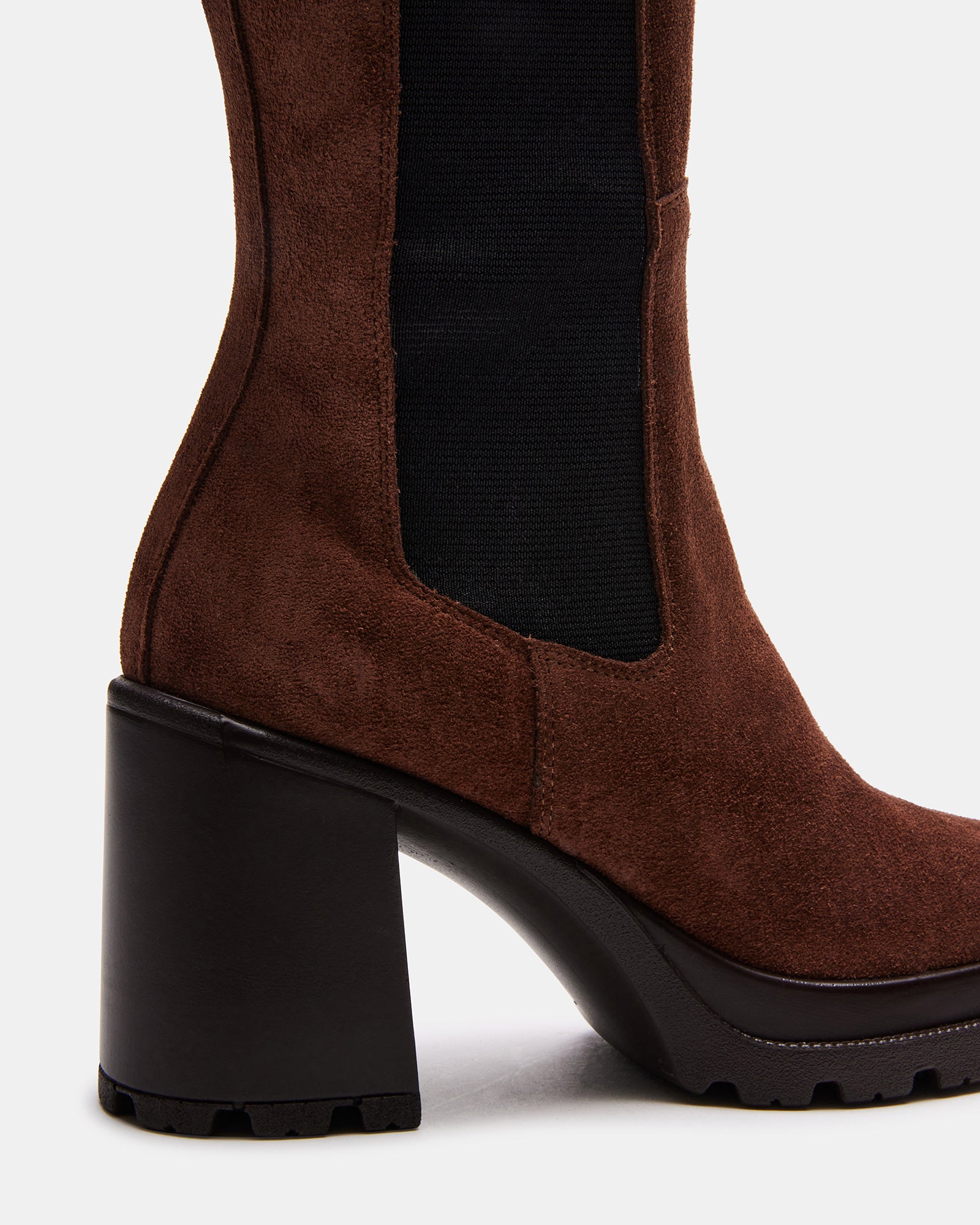 Side view of ALESTI knee high boots highlighting block heel and pull-on design