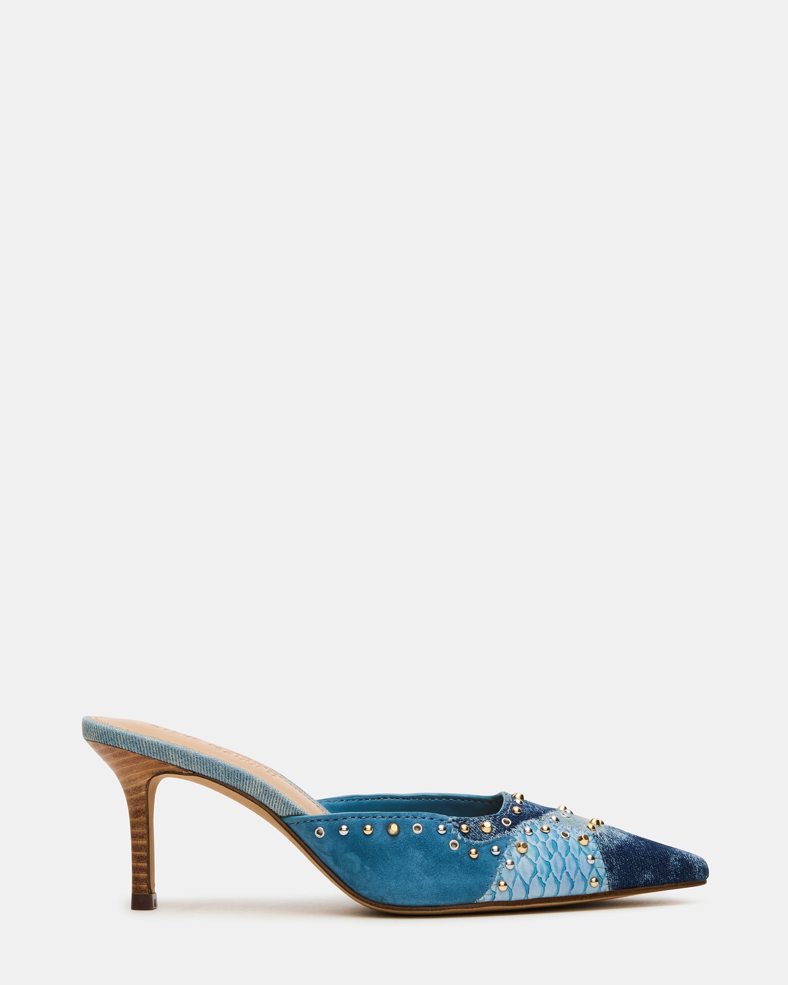 Close-up of denim mule showcasing pointed toe and stud details