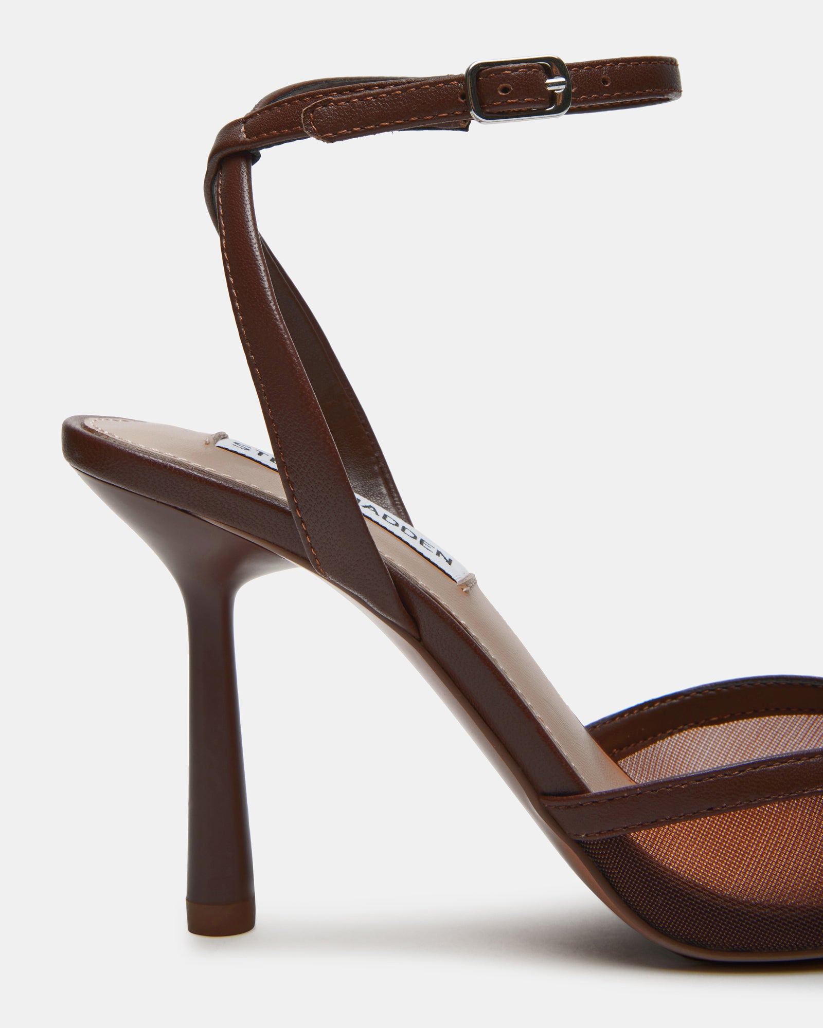 Side view of pointed toe pumps showcasing the chic ankle strap