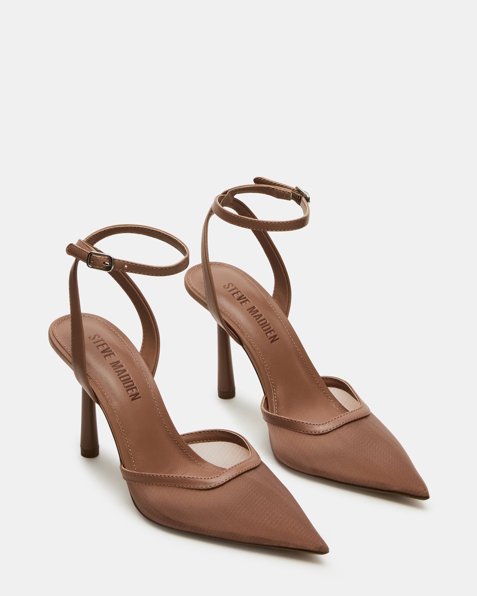 Close-up of the buckle closure on the crossed ankle strap