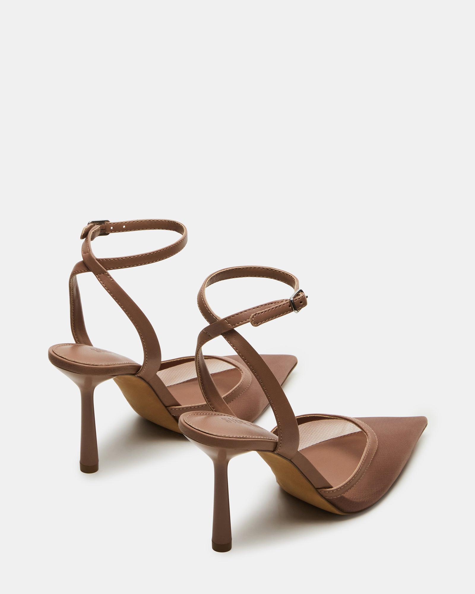Close-up of the buckle closure on the crossed ankle strap