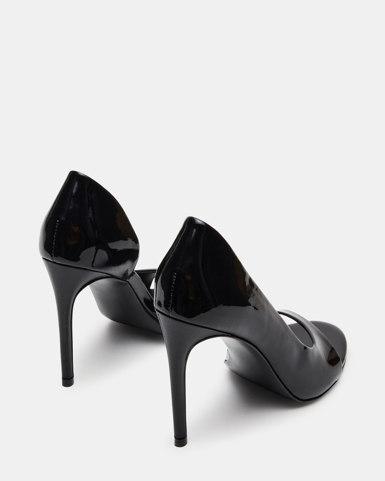 Model wearing sleek black open toe heels for an evening event