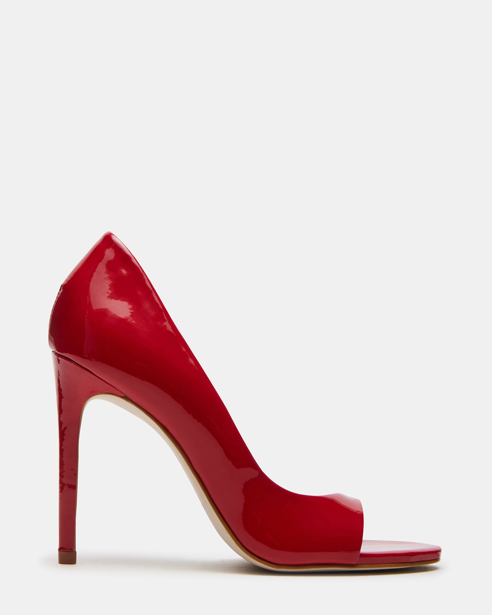 Side angle of red open toe shoes showing stiletto heel height