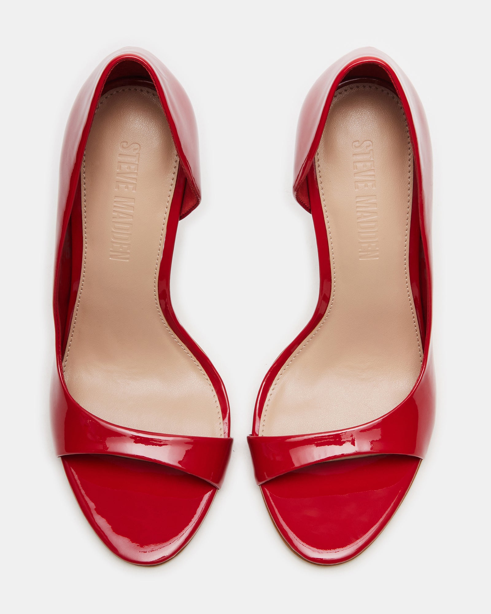 Side angle of red open toe shoes showing stiletto heel height