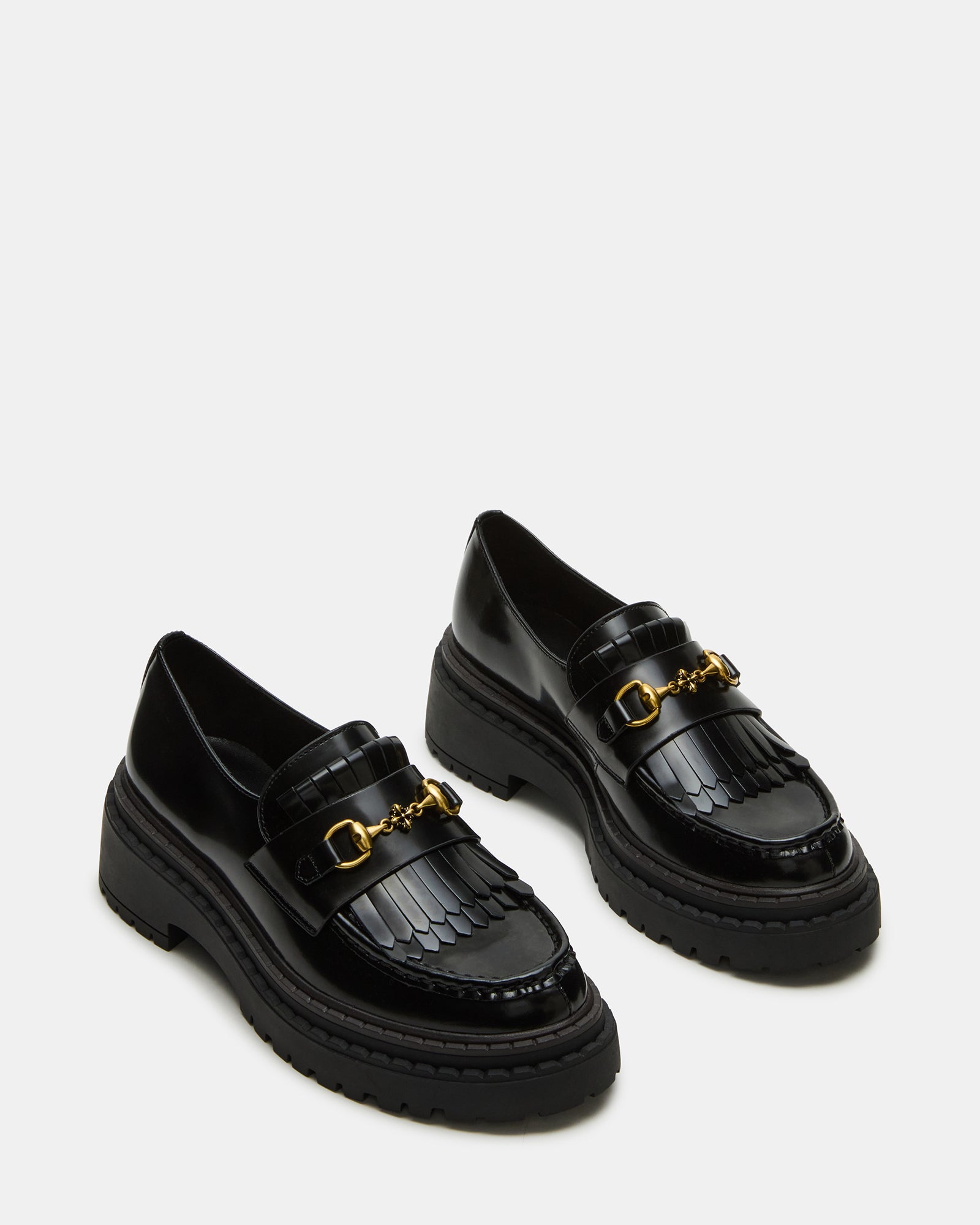 Close-up of horse-bit hardware detail on womens platform loafers