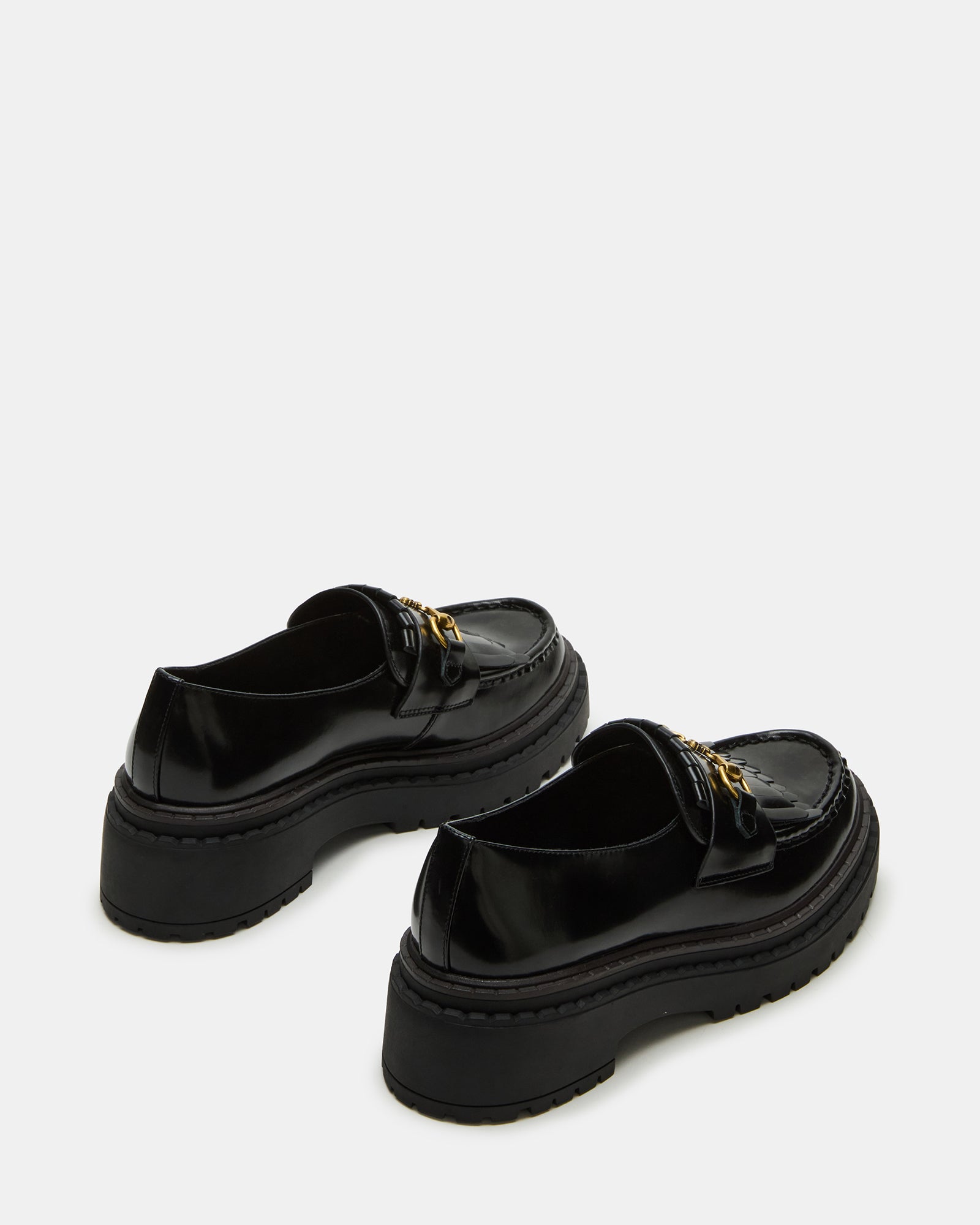 Close-up of horse-bit hardware detail on womens platform loafers